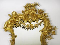 Belle Epoque 19th-20th Century Louis XV Style Giltwood Carved Cherub Mirror