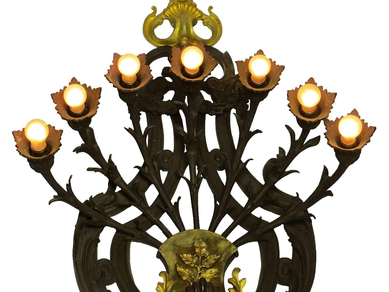 Early 20th Century Large French Art Deco Patinated and Gilt Bronze Seven-Light Figural Wall Sconce For Sale