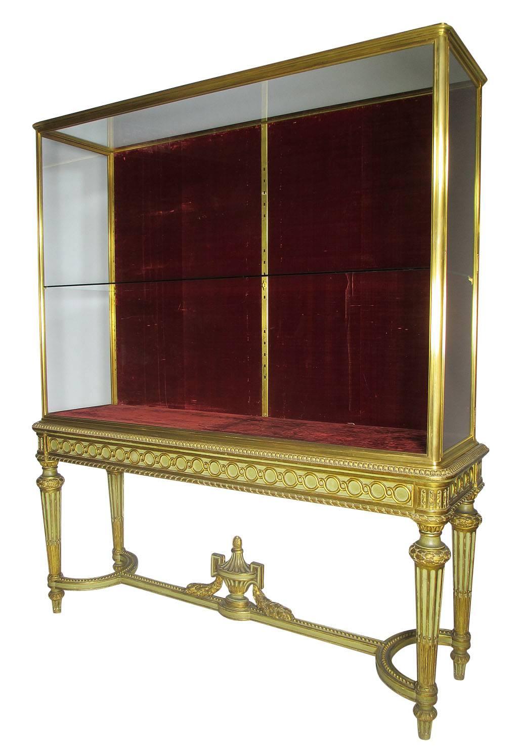 A very fine French Louis XVI style Belle Époque gilt bronze and carved verde green and parcel-gilt exhibition vitrine display cabinet with side doors, circa 1900, Paris.

Measures: Height 73 1/4 inches (186.1 cm).
Width 63 inches (160 cm).
Depth