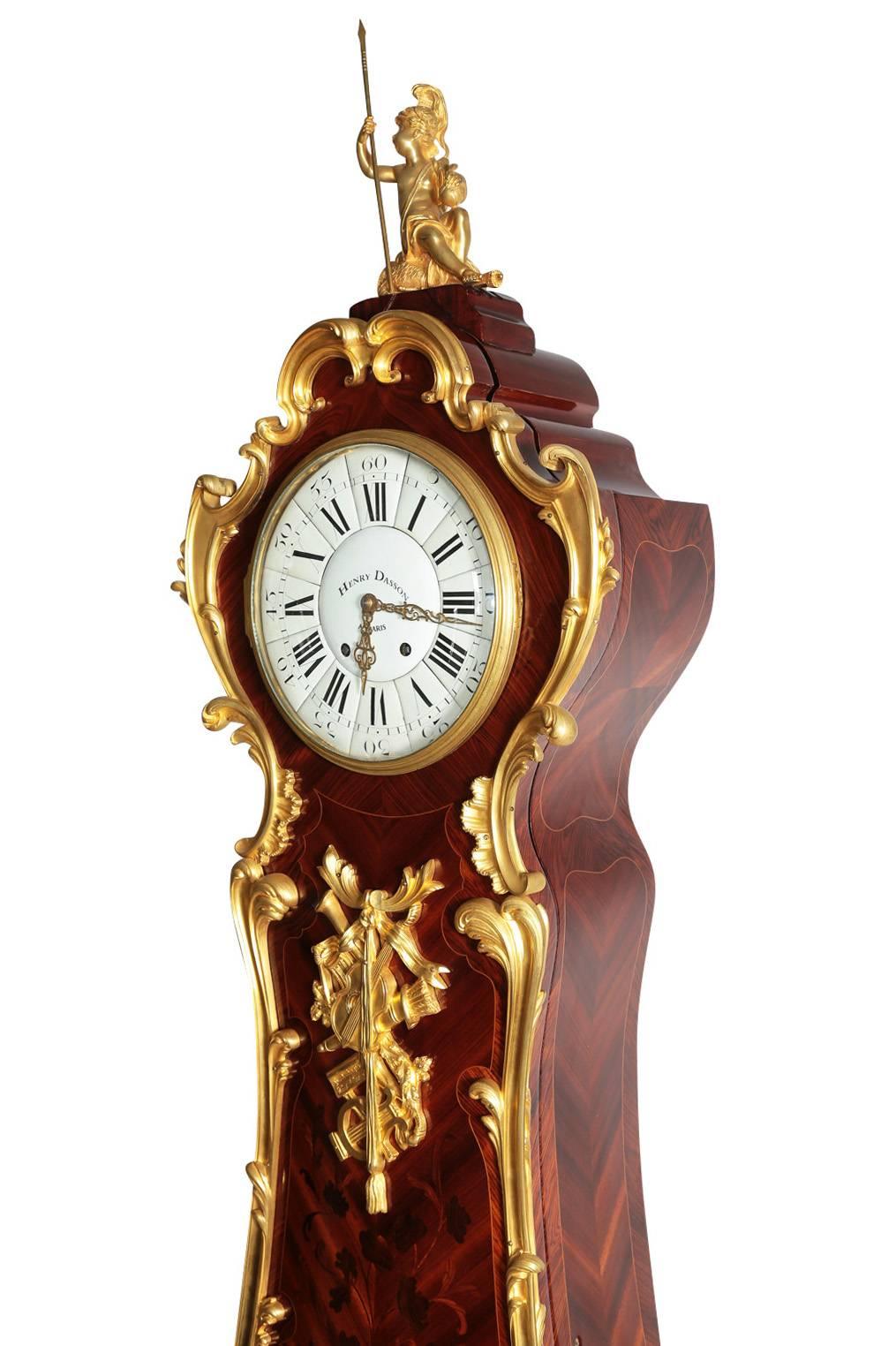 A very fine and palatial French 19th century Regence style figural ormolu-mounted kingwood and tulipwood floral marquetry long-case regulator, after a Model by Charles Cressent (French, 1685-1768). The circular porcelain clock face with Roman