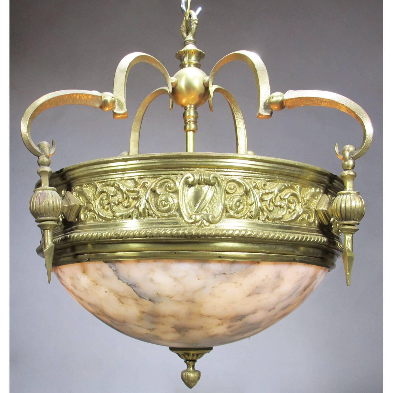 A rare Art-Deco style polished bronze and alabaster three-light hanging plafonnier chandelier. Please note that we have a total of 12 of these plafonnier chandeliers available. The veining on the alabaster will vary on the others, but they were all