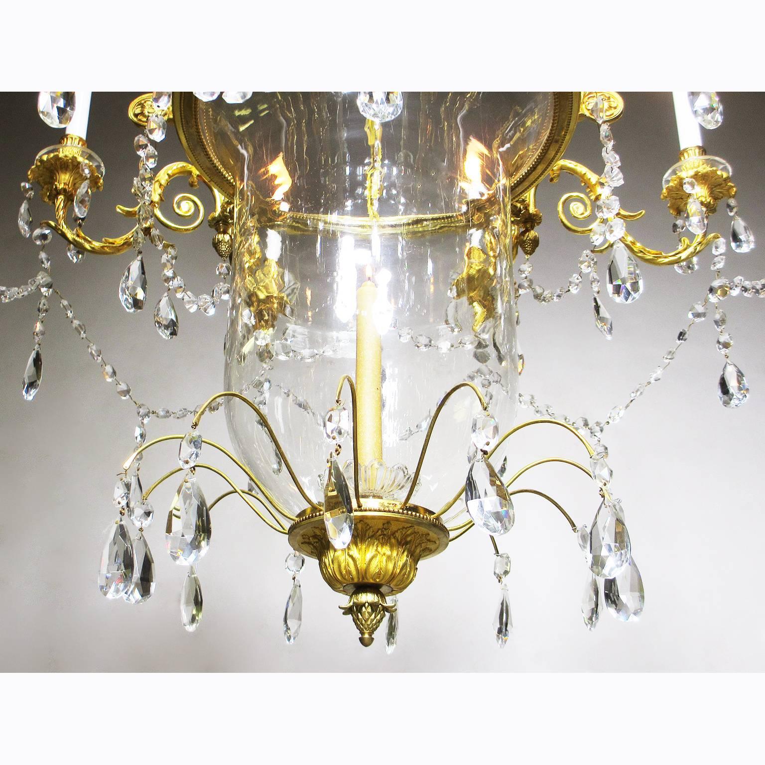 A very fine and rare French 19th century Louis XV style ormolu-mounted and cut-glass eight-light chandelier with a suspended bell-shaped blown-glass candle-bowl, by Mottheau et Fils, Paris. The circular finely chased gilt bronze frame, in satin and