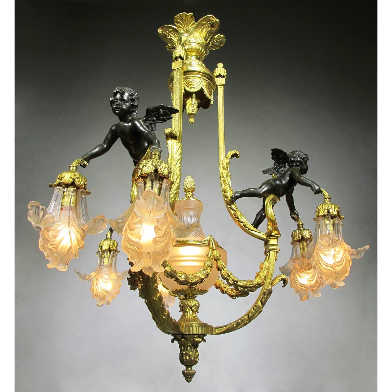 A very fine French 19th-20th century Belle Époque gilt bronze and patinated bronze figural six-light chandelier, with frosted glass shades shaped as flower petals in the manner of René Lalique (French, 1860-1945), centered with a frosted