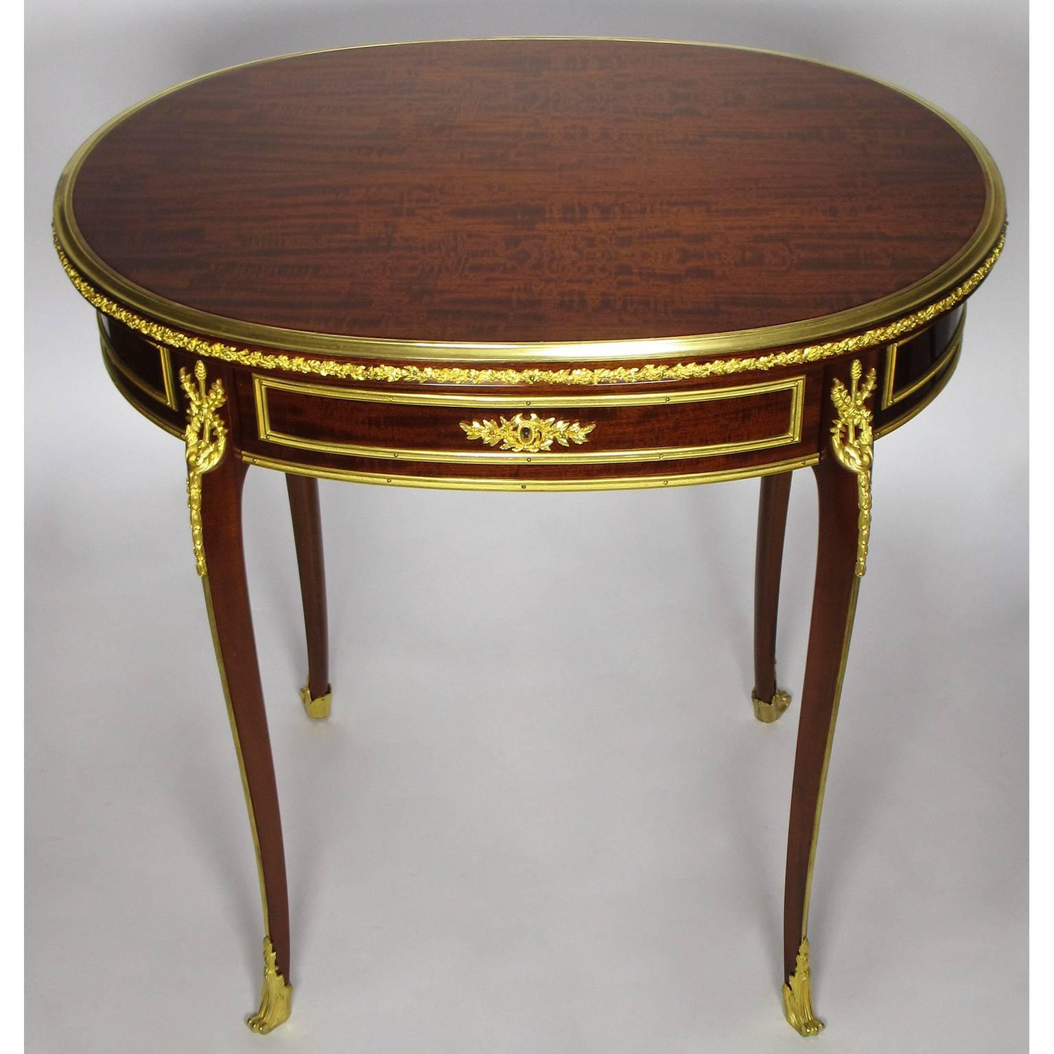A fine French 19th century Louis XV style ormolu-mounted mahogany single-drawer oval gueridon table attributed to Paul Sormani (1817-1877). The lockpate inscribed: Sormani - PARIS, 134 Bd Haussmann, Paris, circa third quarter of the 19th