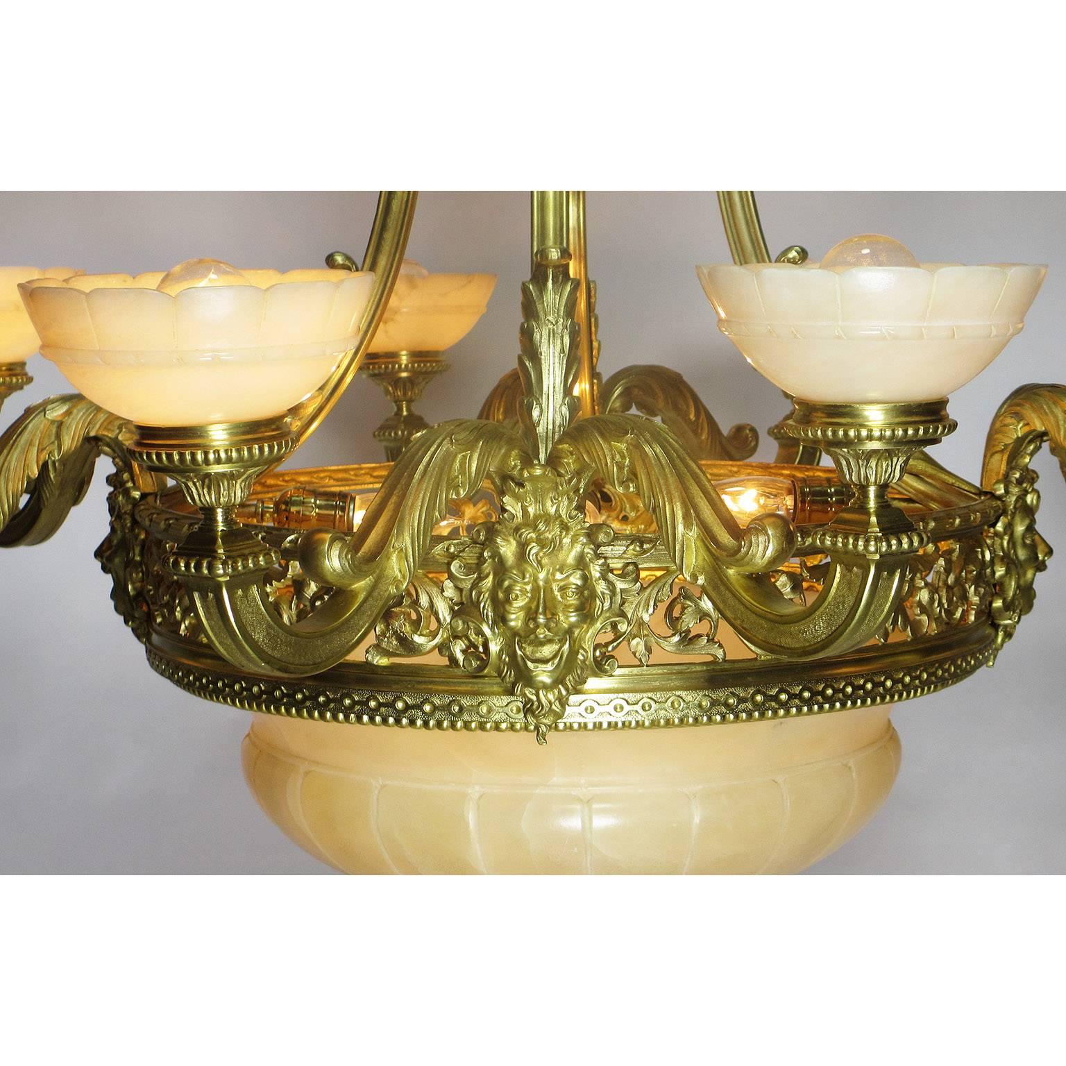 Carved French Art Deco Gilt Bronze and Veined Alabaster Eight-Light Figural Chandelier For Sale