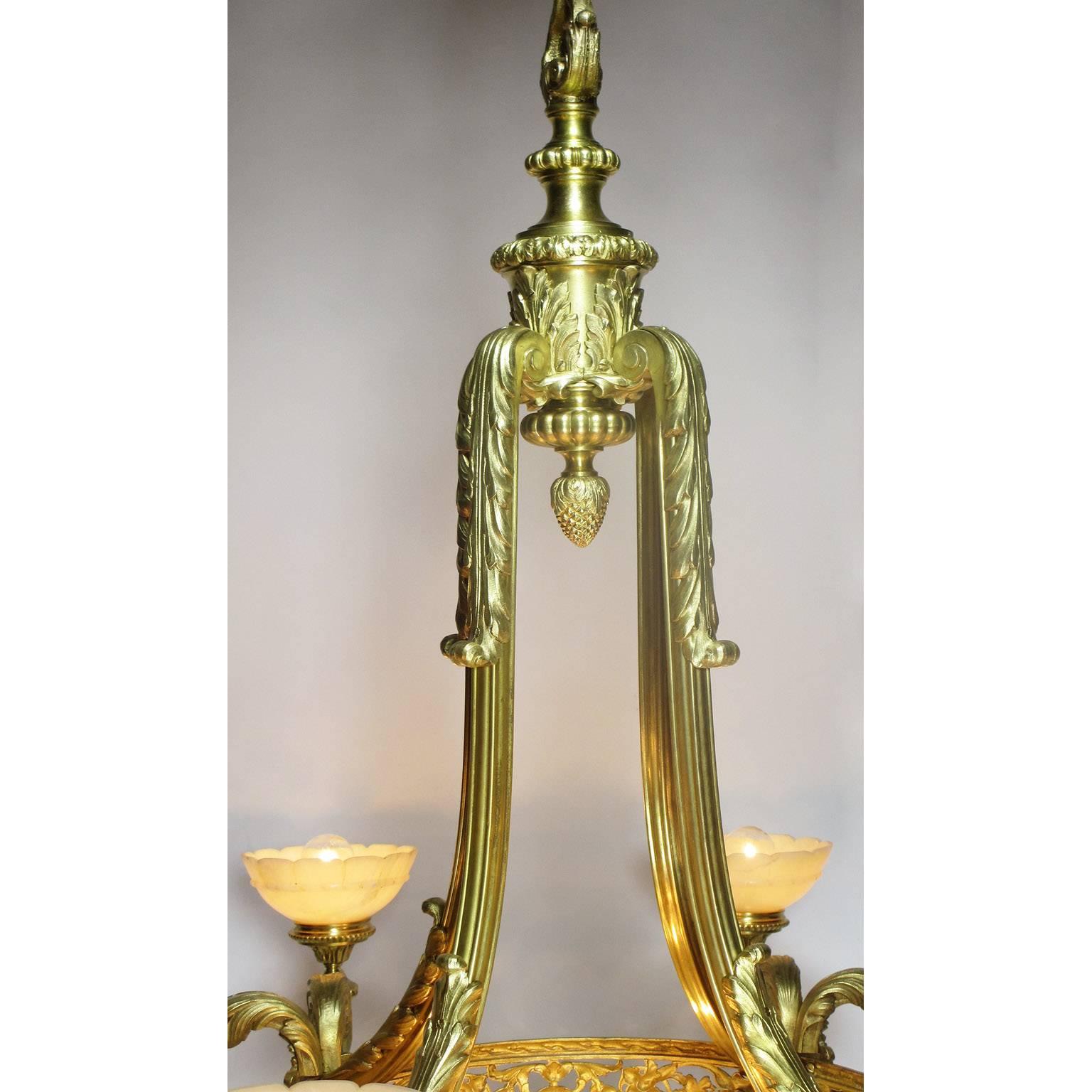 French Art Deco Gilt Bronze and Veined Alabaster Eight-Light Figural Chandelier In Good Condition For Sale In Los Angeles, CA