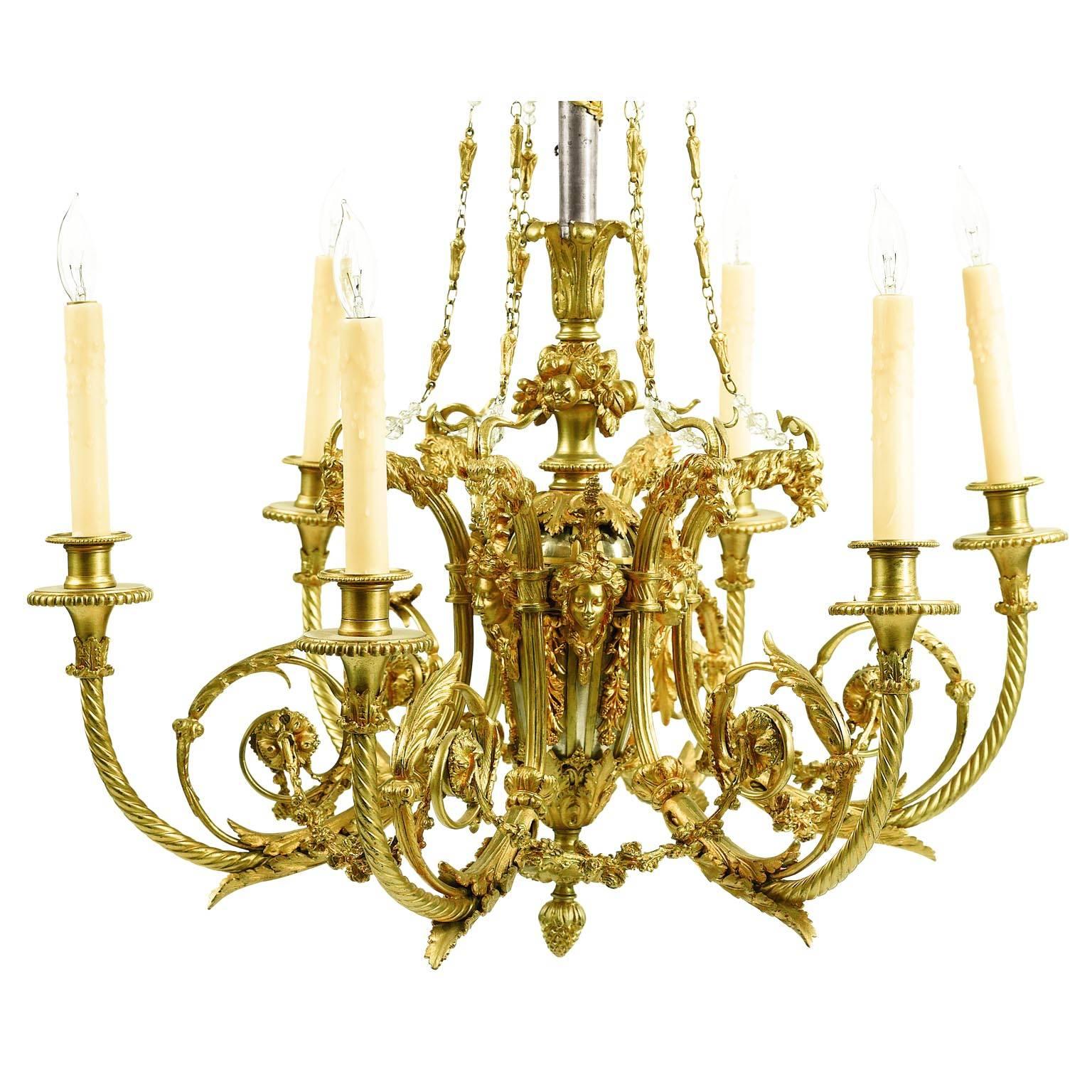A very finely chased French 19th Century Louis XV Style gilt and steel six-light figural chandelier after a model by Pierre Gouthière (French, 1732-1813). The finely chase gilt bronze body surmounted with six scrolled and twisted candle-arms with