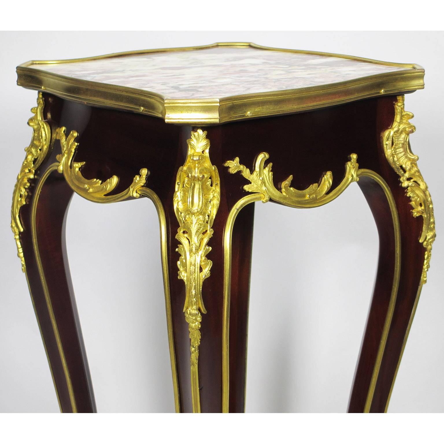 A fine French 19th-20th century Louis XV style mahogany and gilt bronze-mounted side table in the manner of François Linke (1855-1946). The square shaped top fitted with a Brêche Violette marble top with a gilt bronze trim, the body surmounted