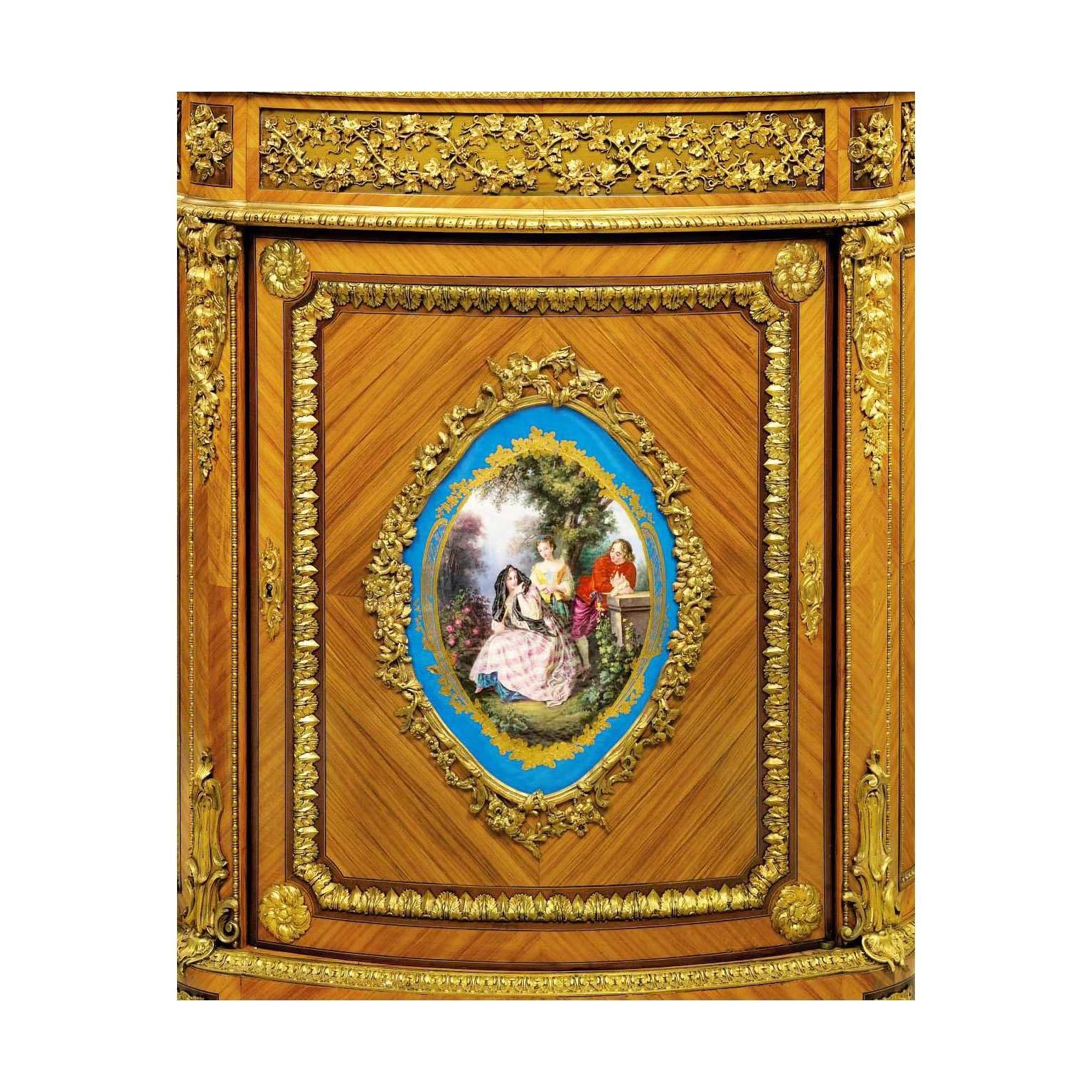 A very fine French Louis XVI style ormolu-mounted and Sèvres style porcelain mounted tulipwood and mahogany Meuble d'Appui (Wall cabinet) with an onyx marble top. The serpentine single-door body surmounted with finely chased gilt-bronze mounts