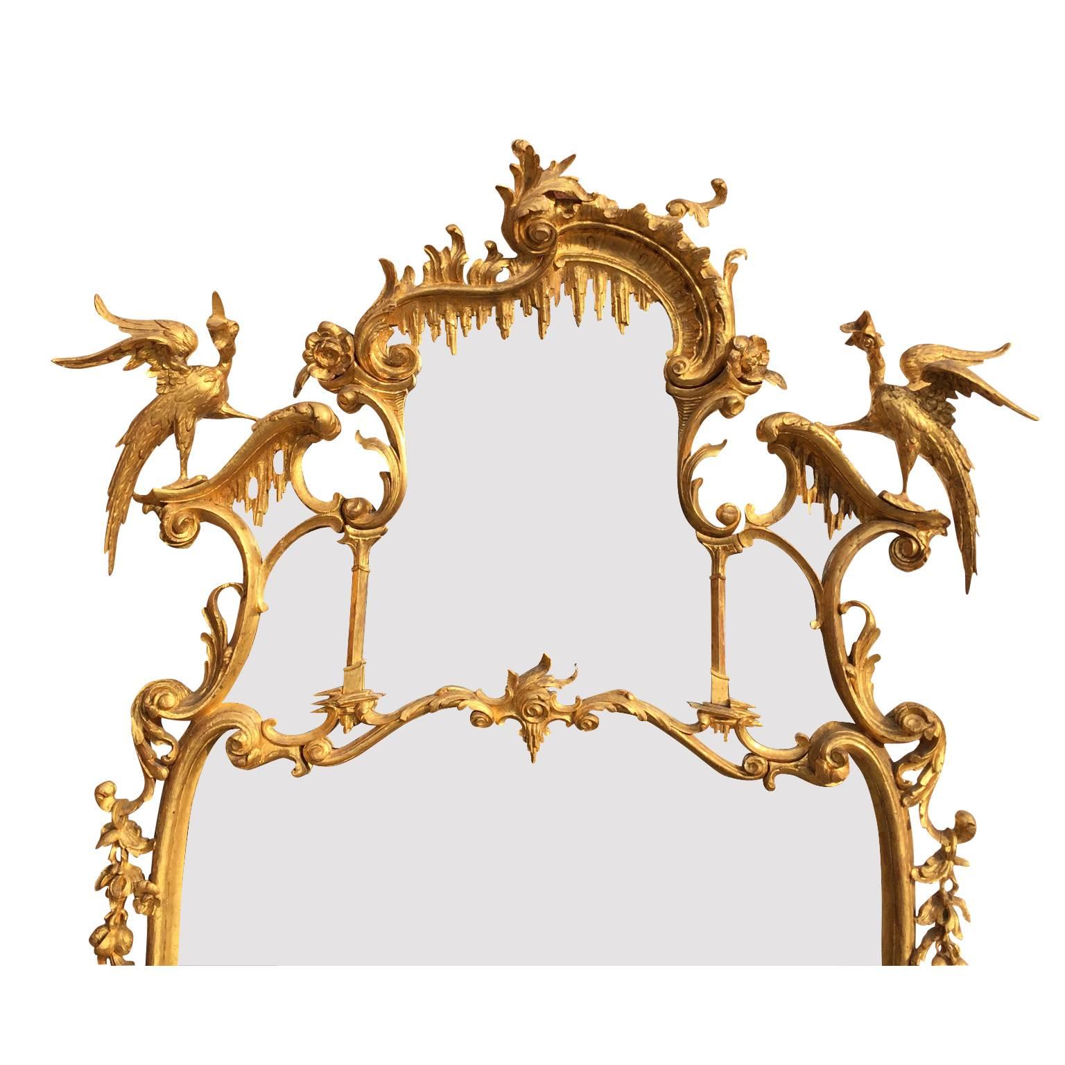 A very fine and Impressive English Rococo 19th century Chippendale style Figural gilt wood carved Over mantel or Pier mirror in the manner of Thomas Johnson after his Collection of Designs, 1758. The sectional divided ornately carved gilt wood frame