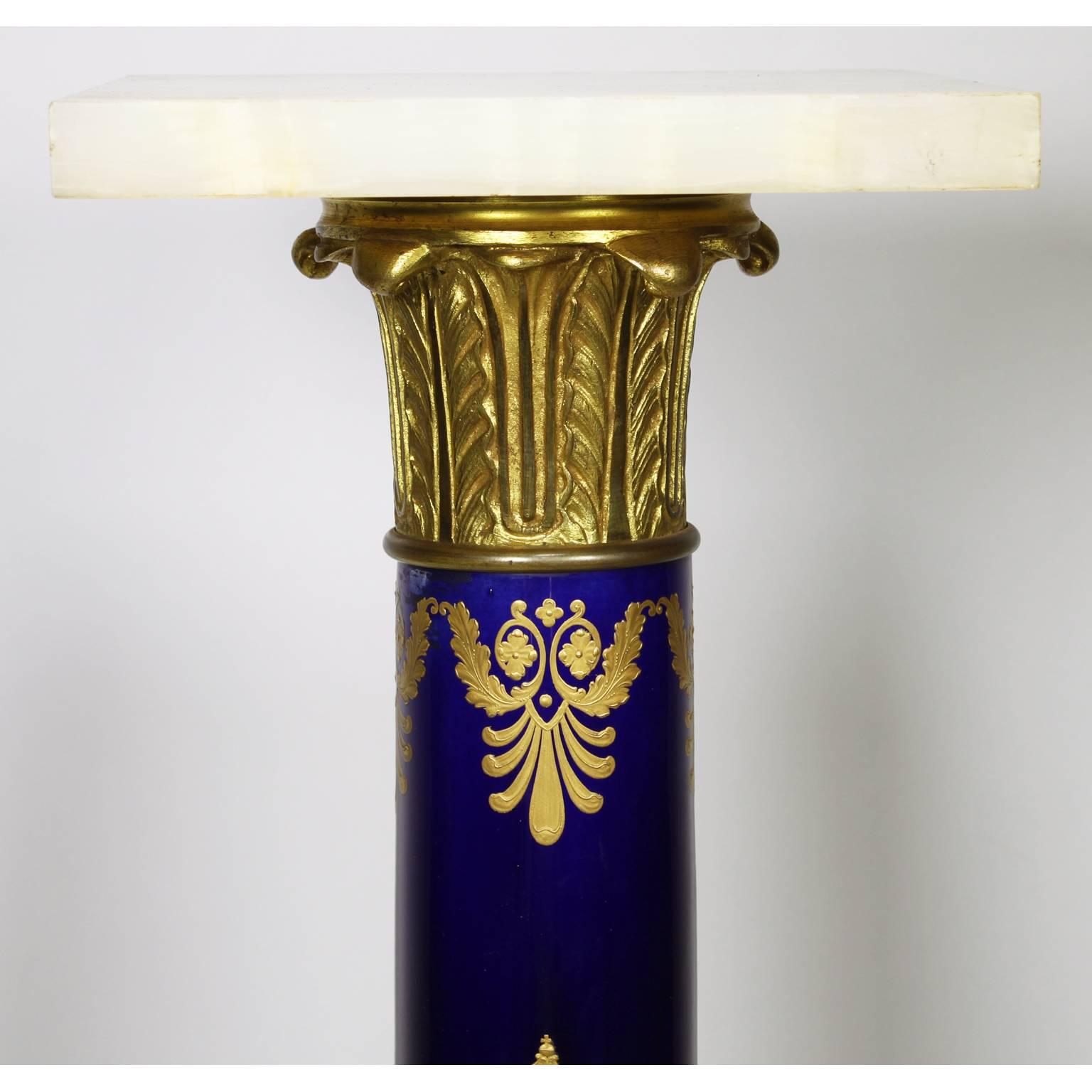 A fine French Empire Napoleon III probably sevres porcelain gilt bronze mounted and onyx pedestal stand with fine 24-carat gild decorated with wreaths around the letter 