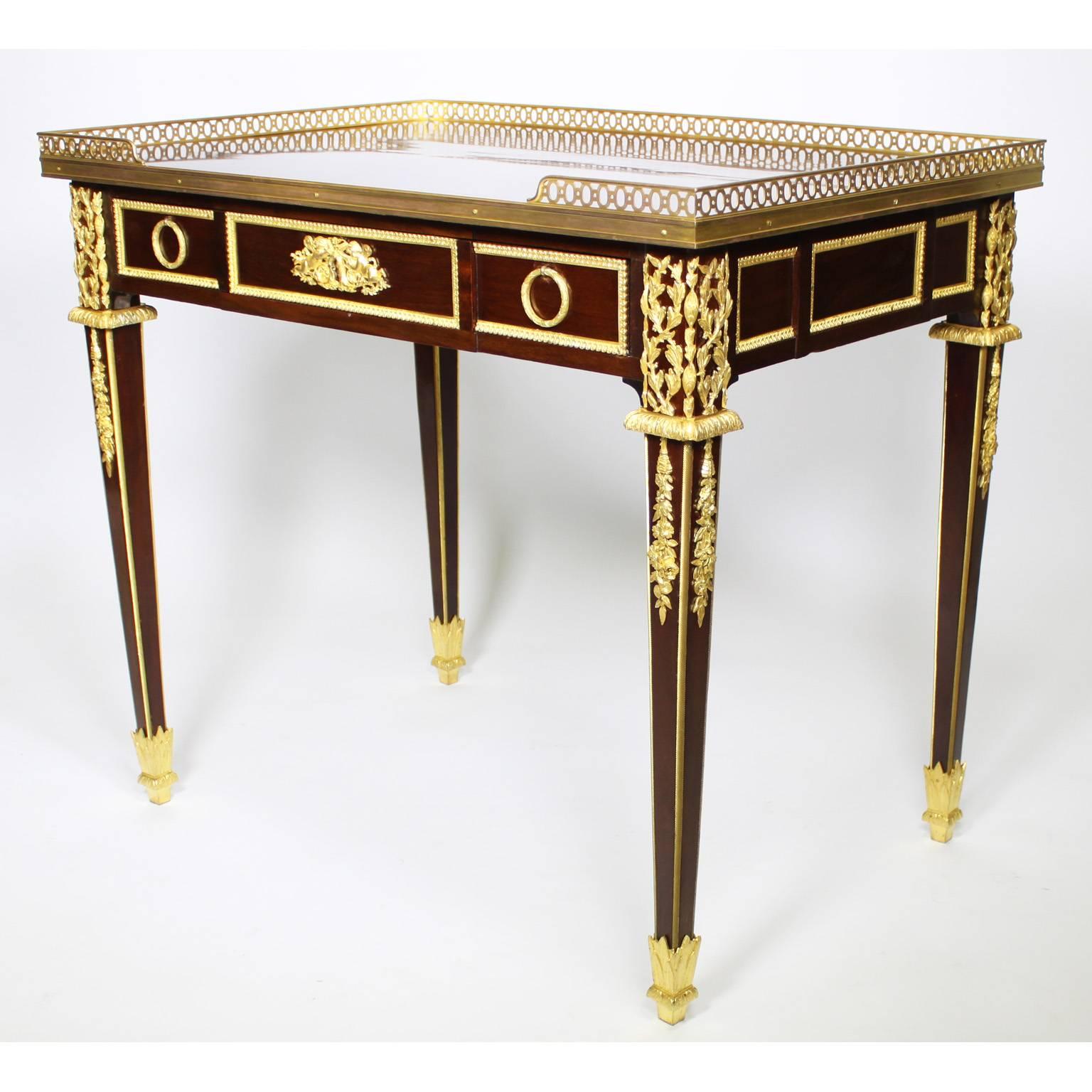 A fine French 19th-20th century Louis XVI style mahogany and gilt bronze-mounted single drawer side table with finely chased floral and cherubs mounts and a pierced-bronze gallery, in the manner of François Linke (1855-1946), circa 1900,