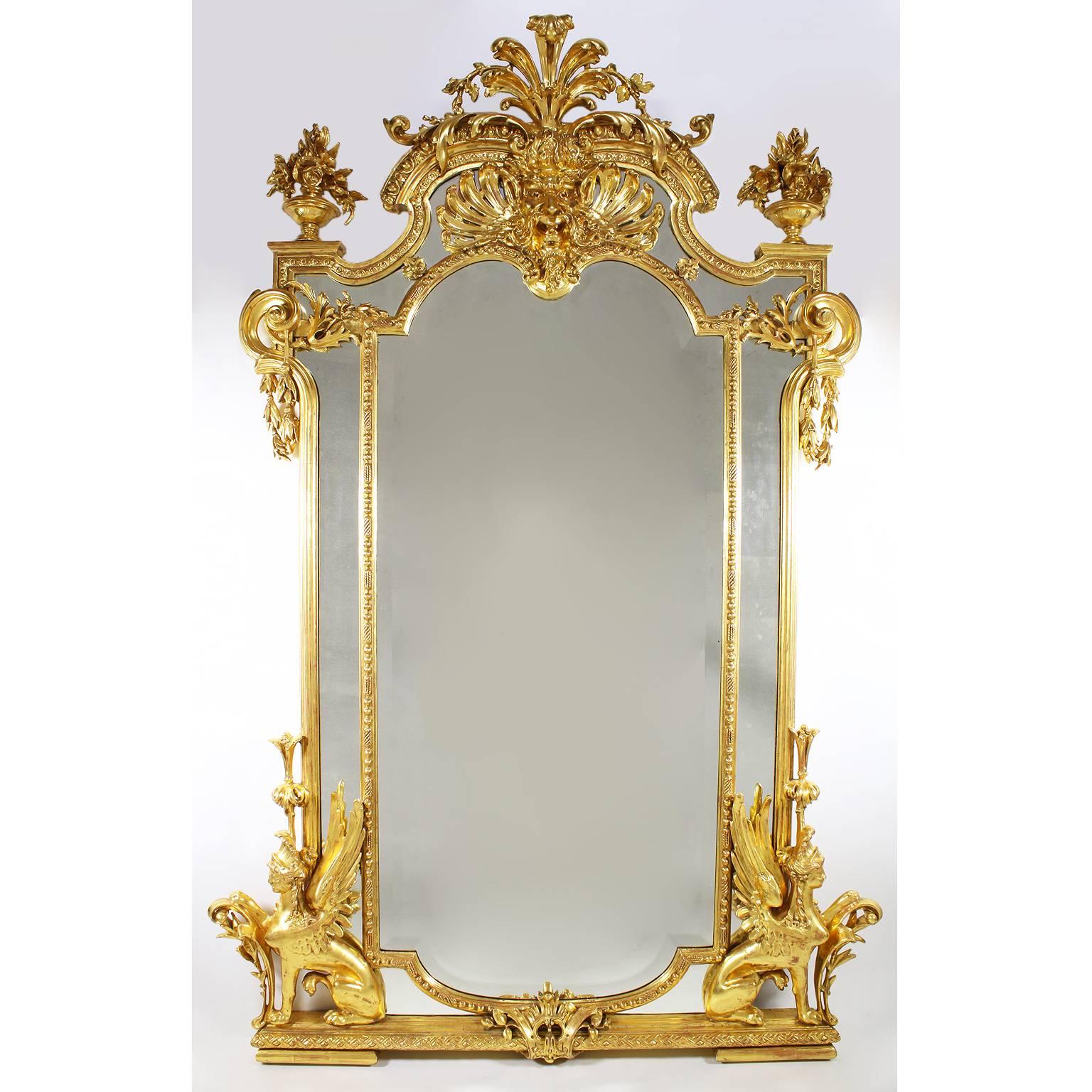 A fine French Empire Revival 19th century giltwood and Gesso carved figural console table with matching mirror. The 