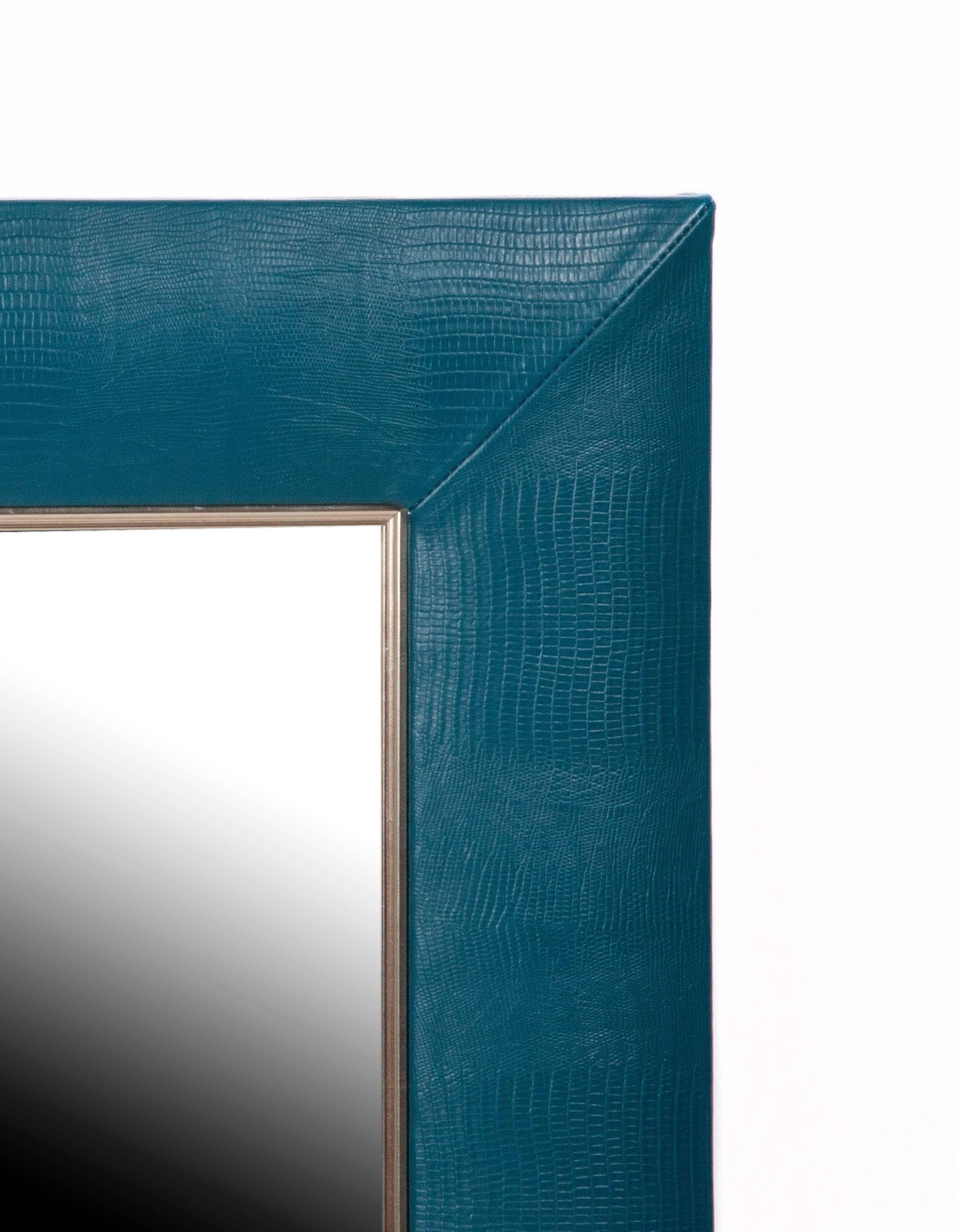 Lizard embossed Italian leather

1 ¼” beveled mirror
4” wide leather frame
Hand-stitched corners
Measurements including frame: 30” W x 36” H x 1” D

For custom sizes request a quote or call our office to speak to a