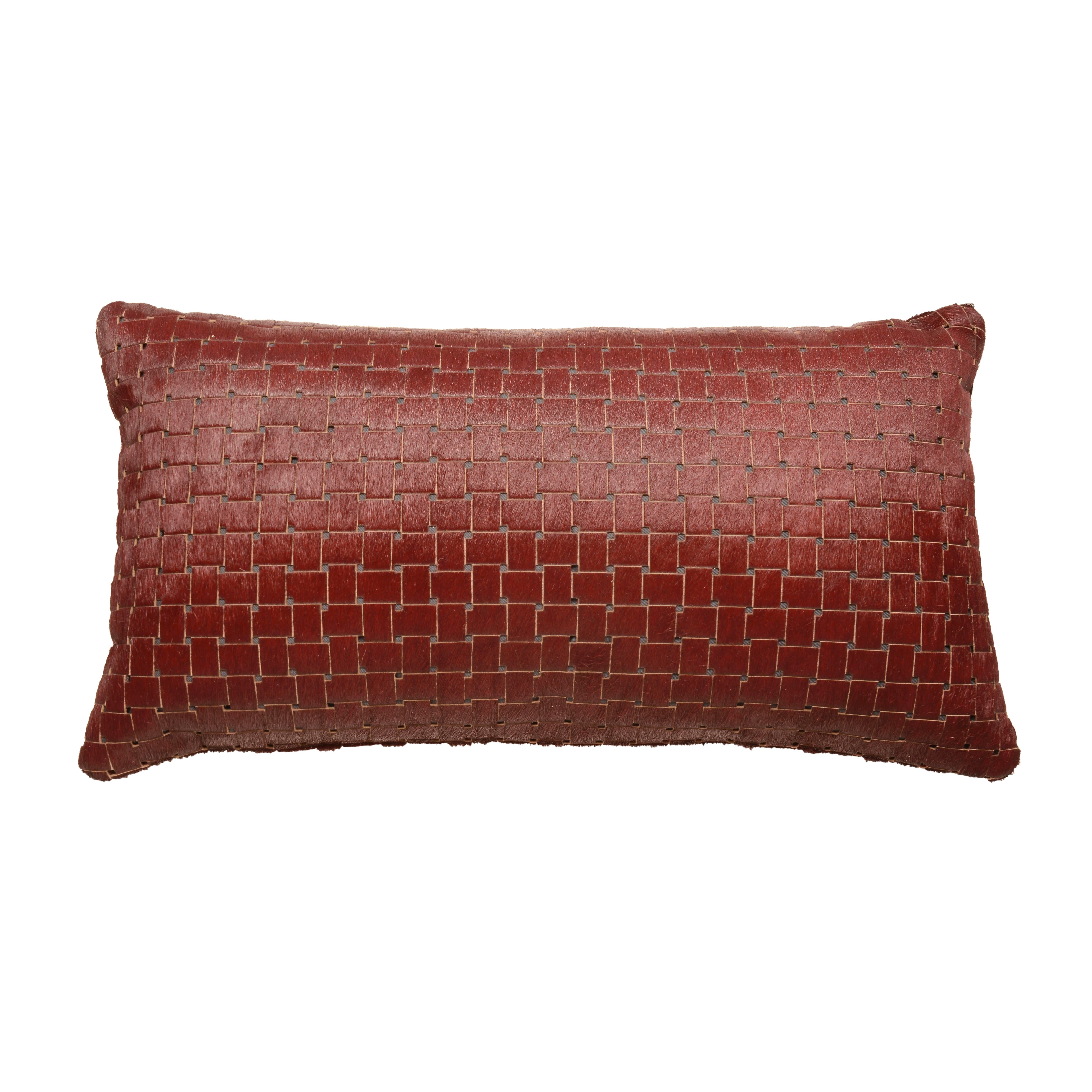 Contemporary burgundy laser cut cowhide hair lumbar pillow

Luxurious high sheen cowhide from Normandy France.
Burgundy with gray lining visible through sure laser cuts.
Basket weave laser cut pattern.
Measures: 12