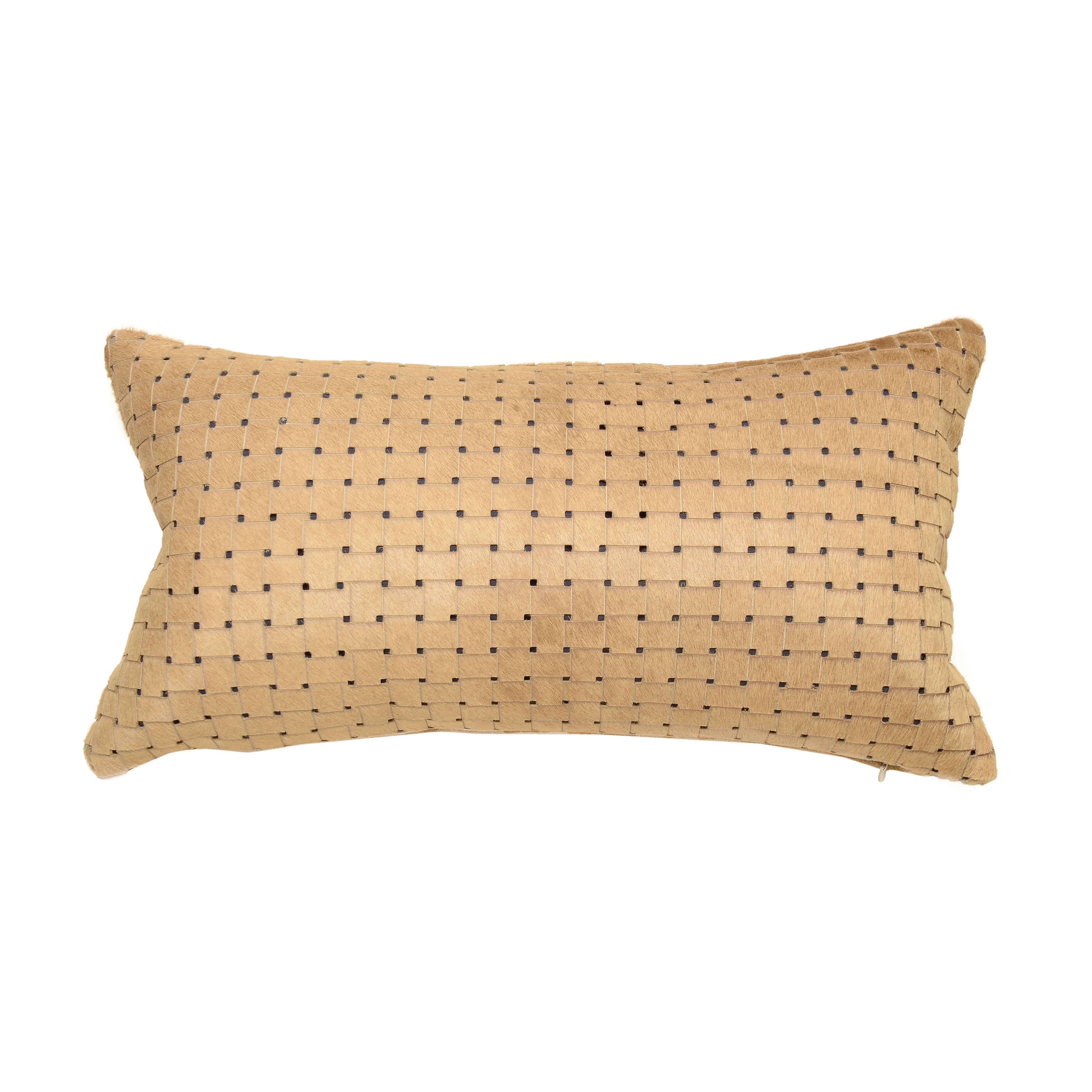 Beige/tan laser cut cowhide hair lumbar pillows.
Luxurious high sheen cowhide from Normandy France.
Beige/Tan hair on hide with gray lining visible through sure laser cuts. 
Basket weave laser cut pattern.
Measures: 12