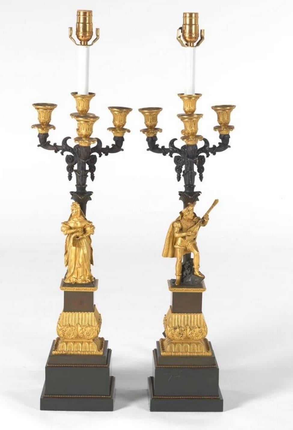 Nice pair of French ormolu and patinated bronze four-light candelabra mounted as lamps.

Wired for electricity.