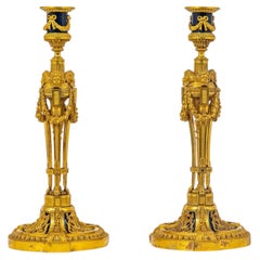 Eccezionale coppia di candelieri francesi in bronzo dorato di Millet, ispirati a Martincourt
