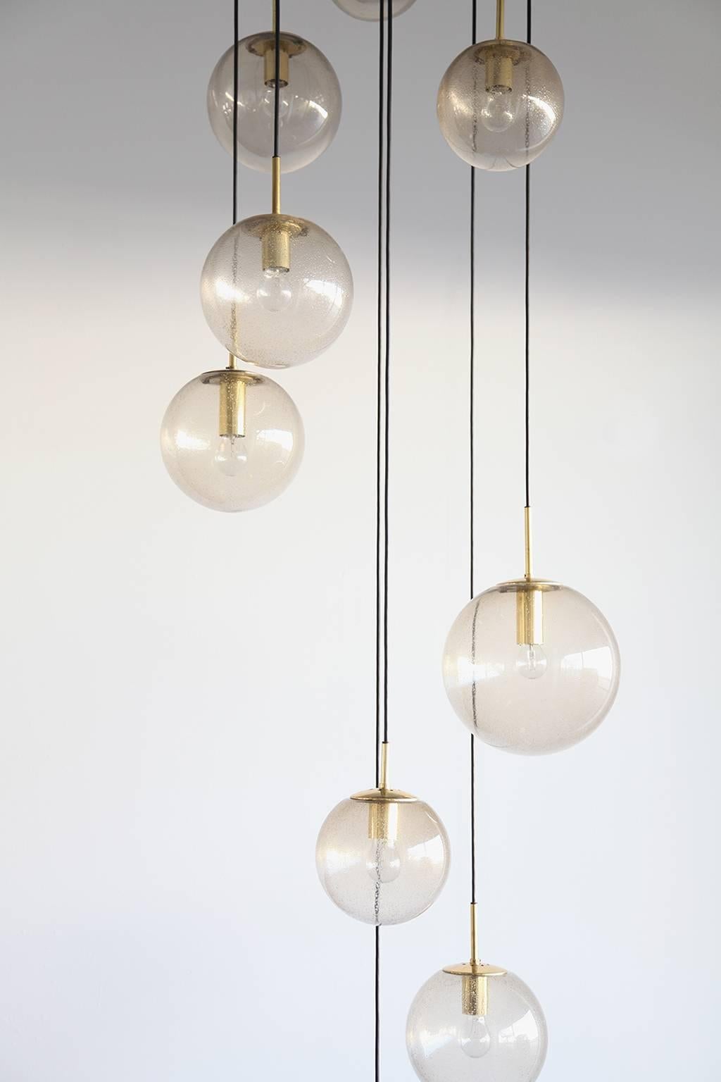 Huge and elegant cascade lamp from the 1960s. The length of each glass can be set individually. The glass is handblown and was manufactured by Limburg. It is accompanied by beautiful brass works.

Dimensions:

Three glass elements Ø 20cm
Four glass