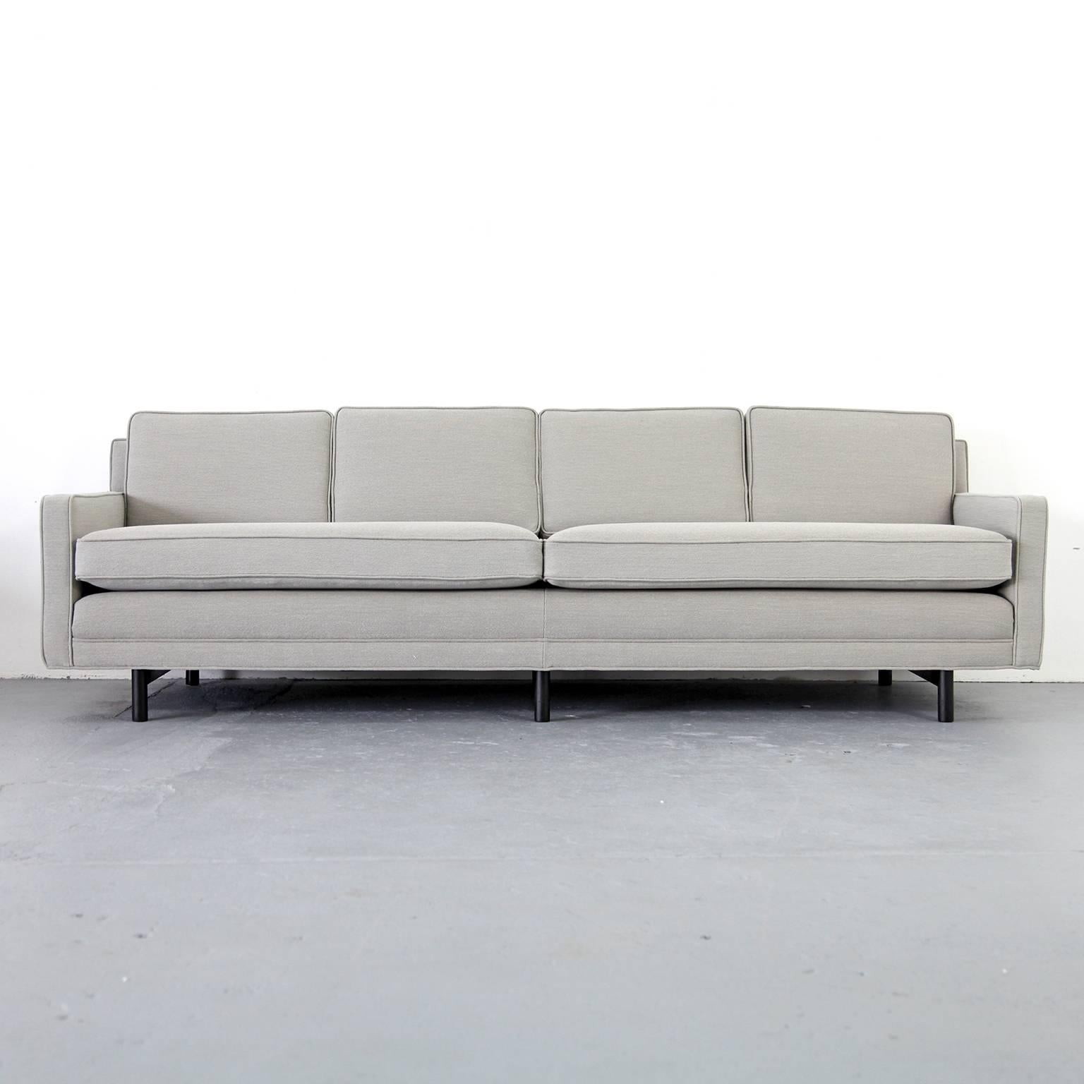 Great looking four-seat sofa by Paul McCobb. This comfortable sofa has completely been restored and re-upholstered.