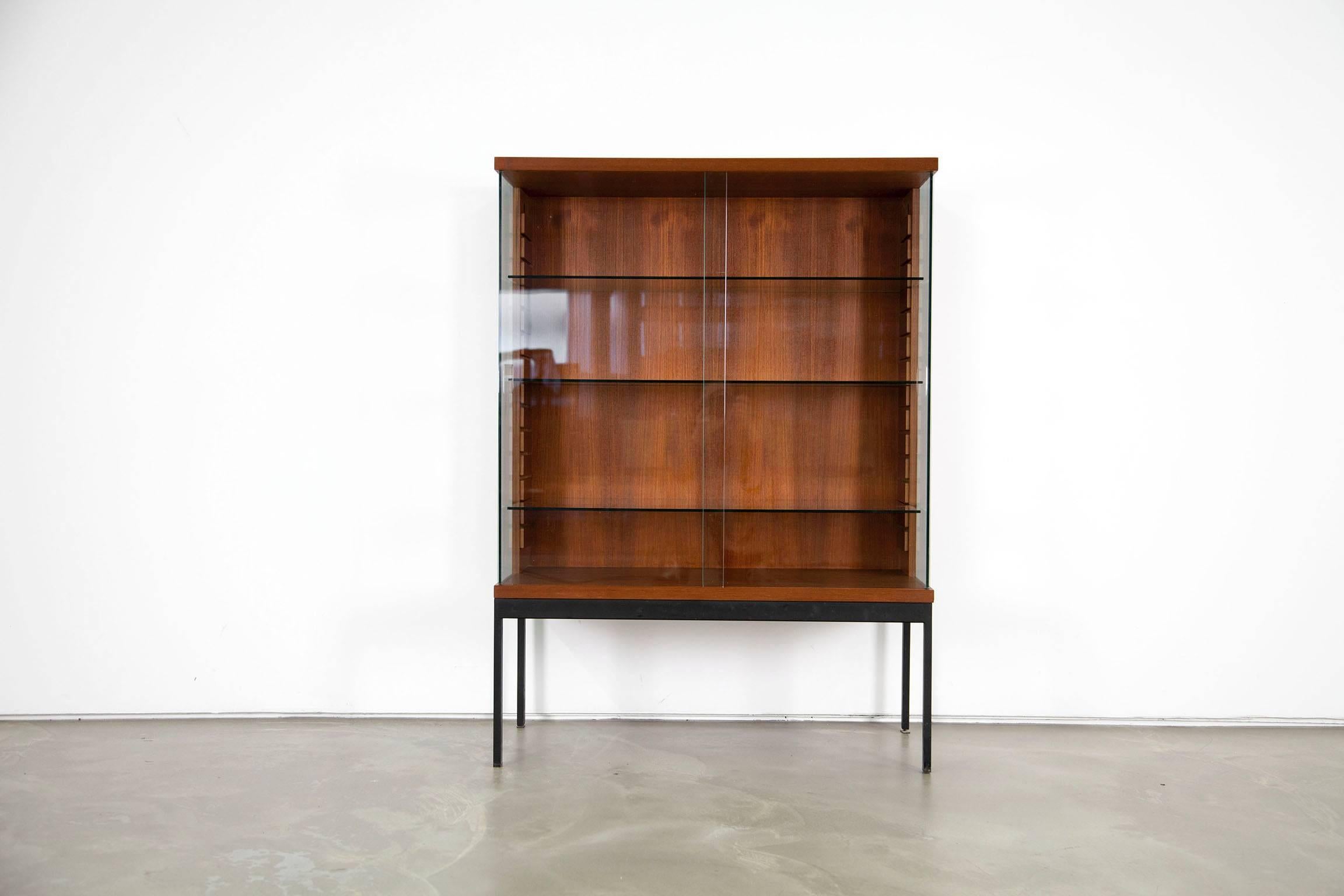 Architectural display cabinet designed by Dieter Waeckerlin. The cabinet is veneered with teakwood.