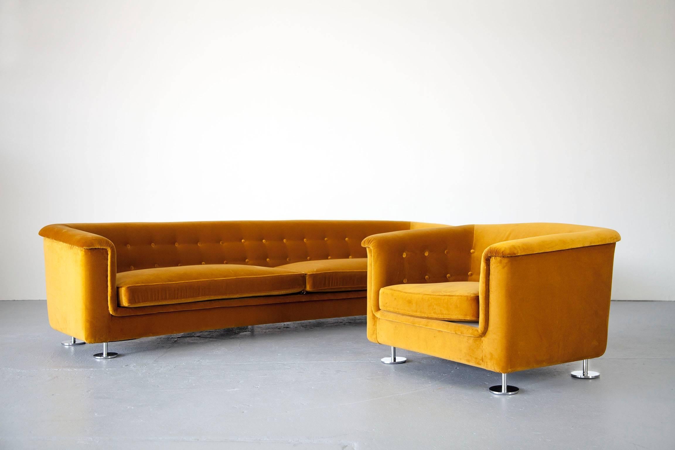 Sophisticated seating group made by Hans Kaufeld. Both pieces have new upholstery and are covered in mustard colored velvet.

Dimensions: 
Chair: D 85 cm; W 91 cm; H 63 cm; SH 35 cm.
Sofa: D 90 cm; W 262 cm; H 62 cm; SH 35 cm.
 