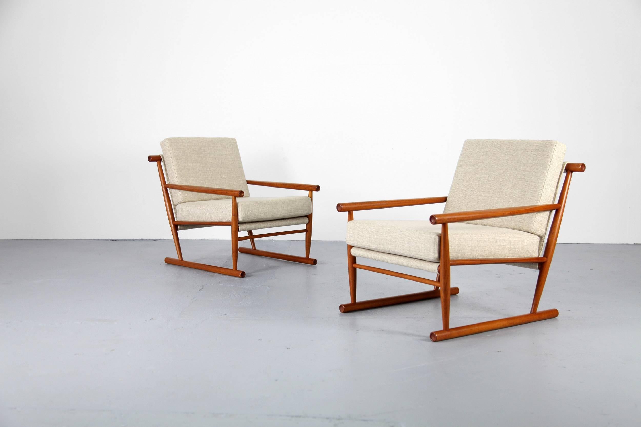 Set of two beautifully constructed sled easy chairsfrom the 1960s. The chairs show sophisticated design and workmanship. The upholstery is new and has been done with a high quality fabric. Both chairs are in great condition.

 