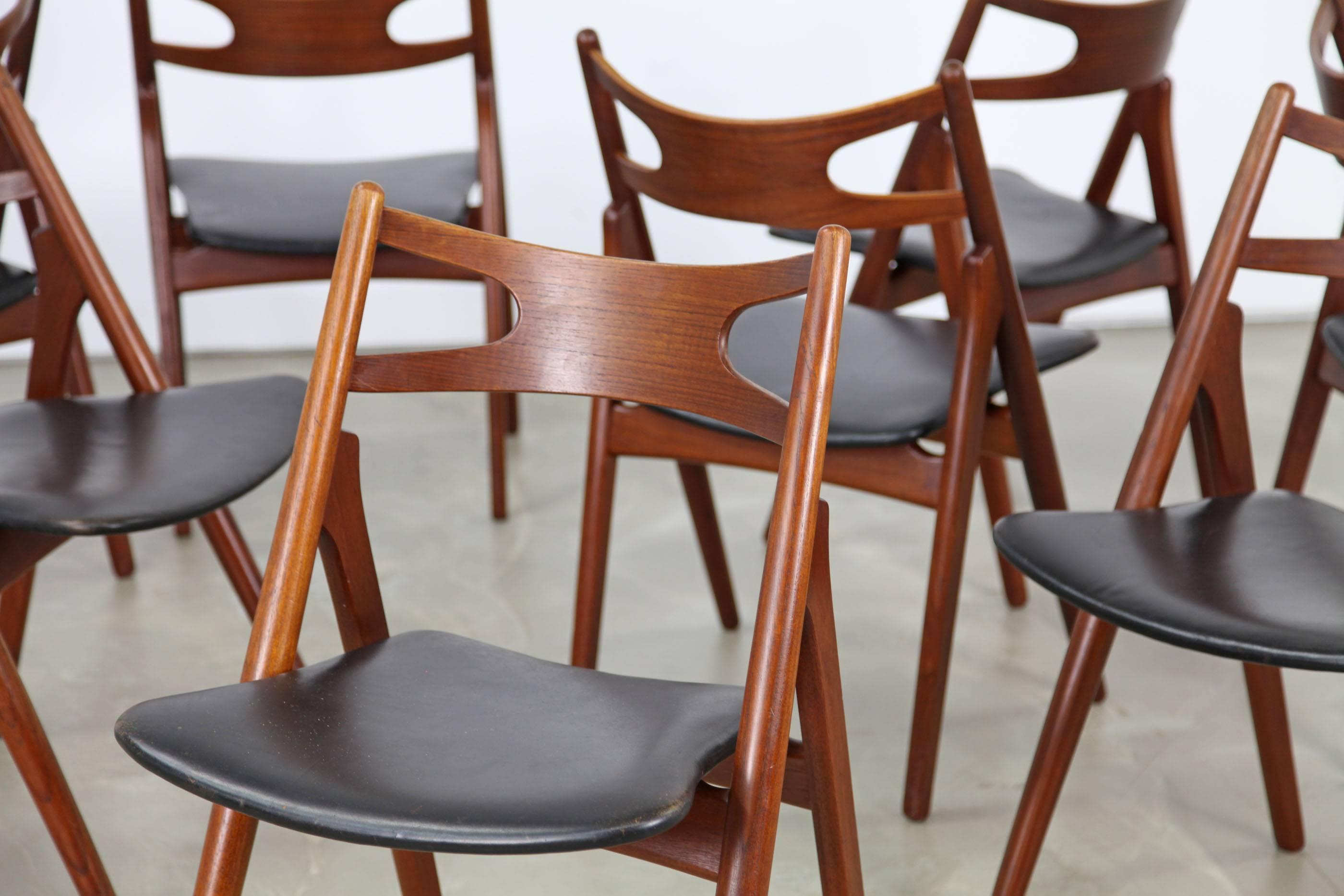 We have sixteen sophisticated chairs model CH-29 designed by Hans J. Wegner. The chairs are of premium quality. The organic frame is made of real teak wood. The chairs come with black leather upholstery and are labeled on the bottom. Great condition