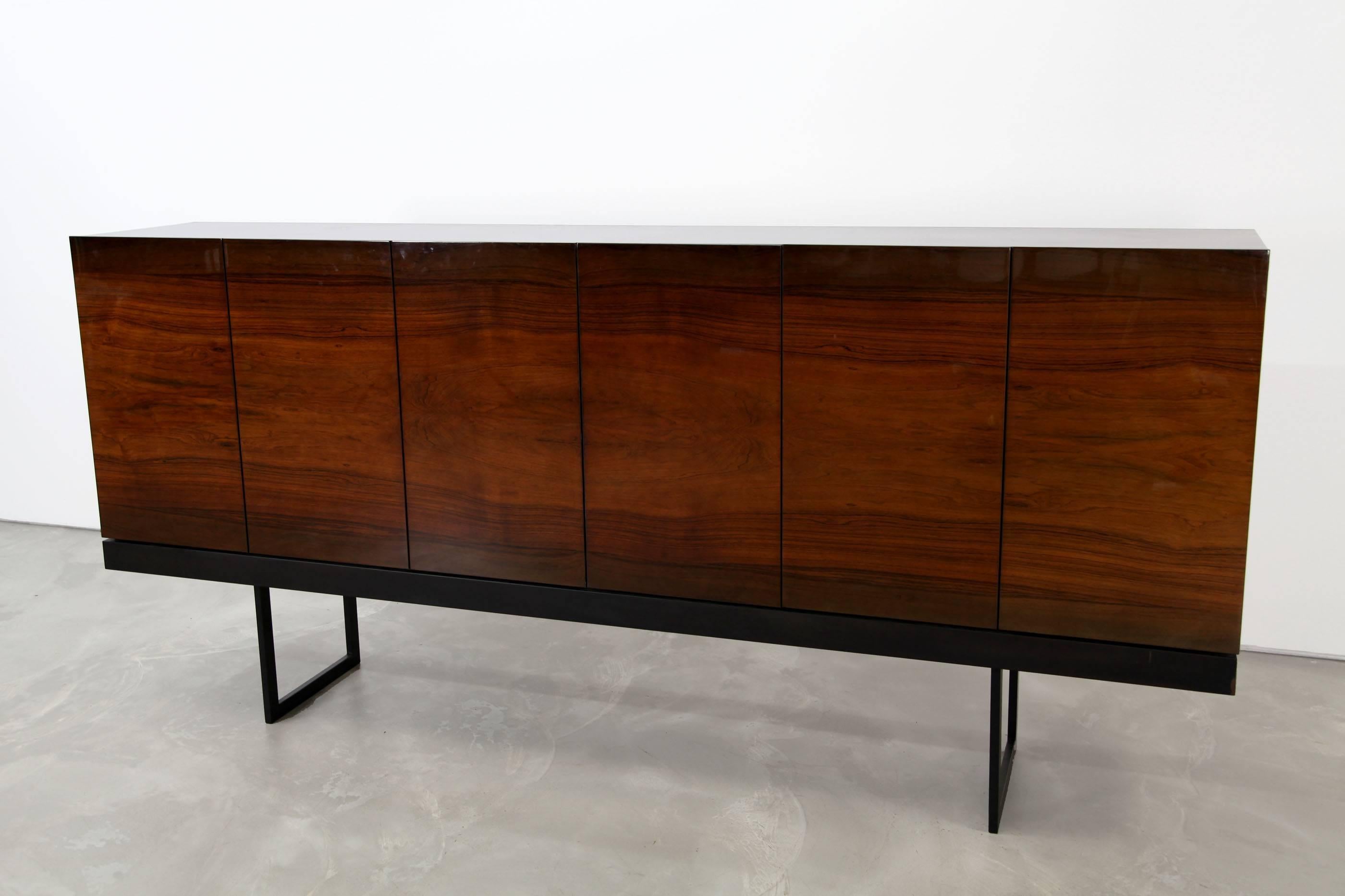 Huge high board from the 1960s. This piece features a beautiful front and maple interior. Due to the beautiful grain, shiny lacquer on the front and matte lacquer on the top and sides it has an impressive aura.

  