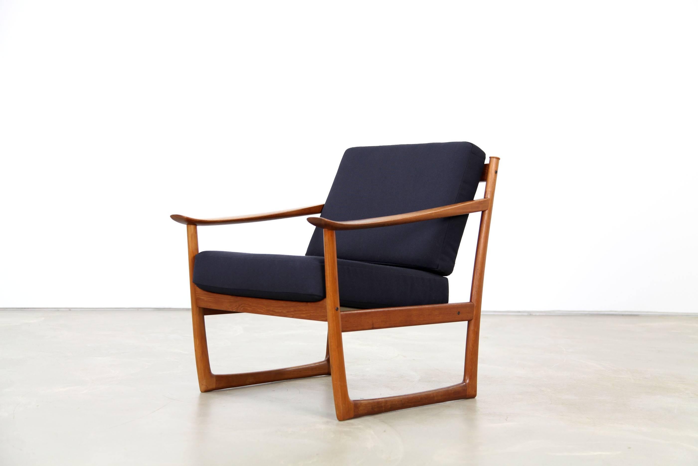 Beautifully shaped teak chair by the Danish designer duo Peter Hvidt and Orla Molgaard Nielsen. Flowing, organic design. The chair is in excellent condition, it was reupholstered with the fabric Steelcut by Kvadrat.