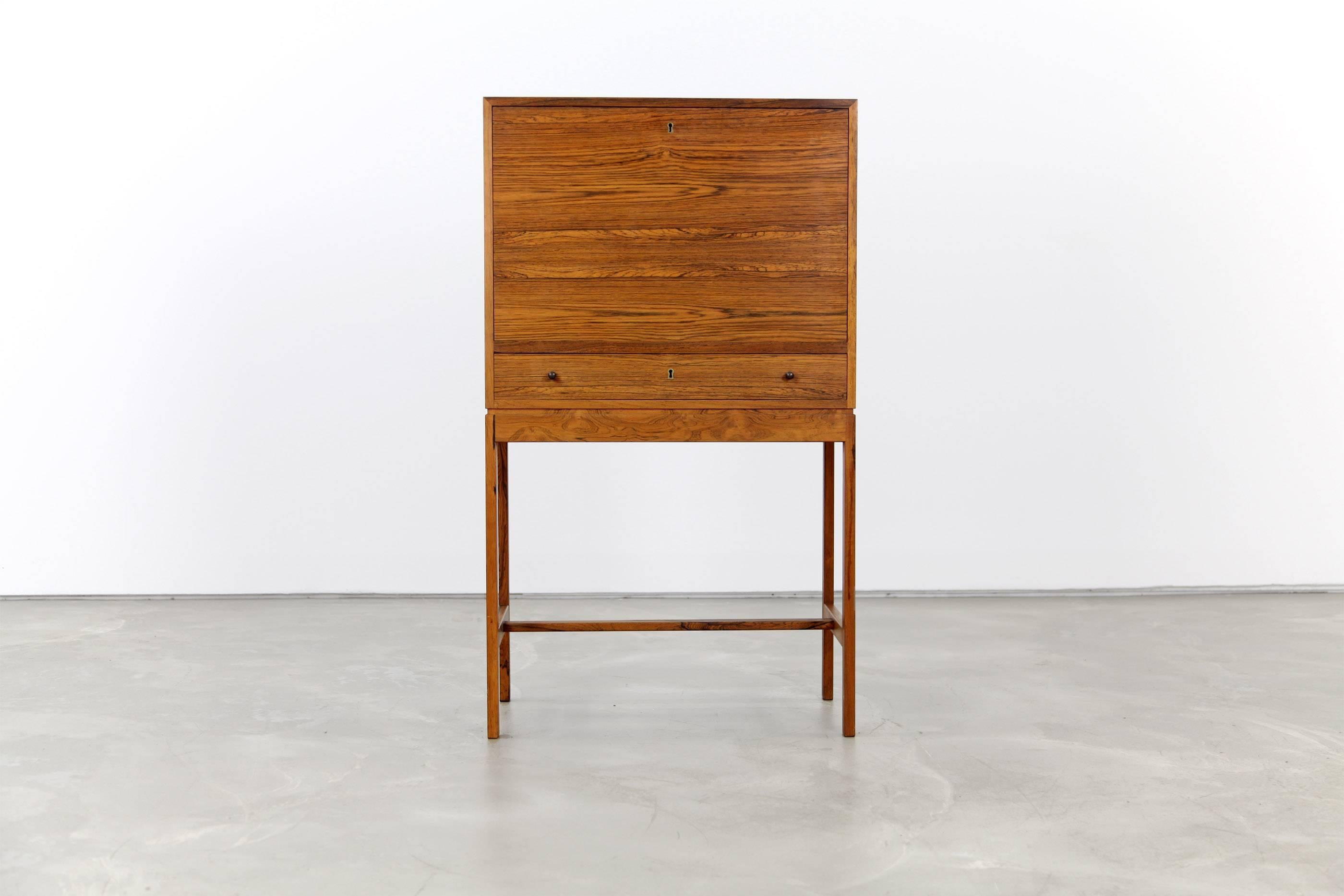 This secretary desk was produced by Jason Møbler in Denmark in the 1960s. It is excellently crafted and shows a very pure design, that appeals timeless and elegant.