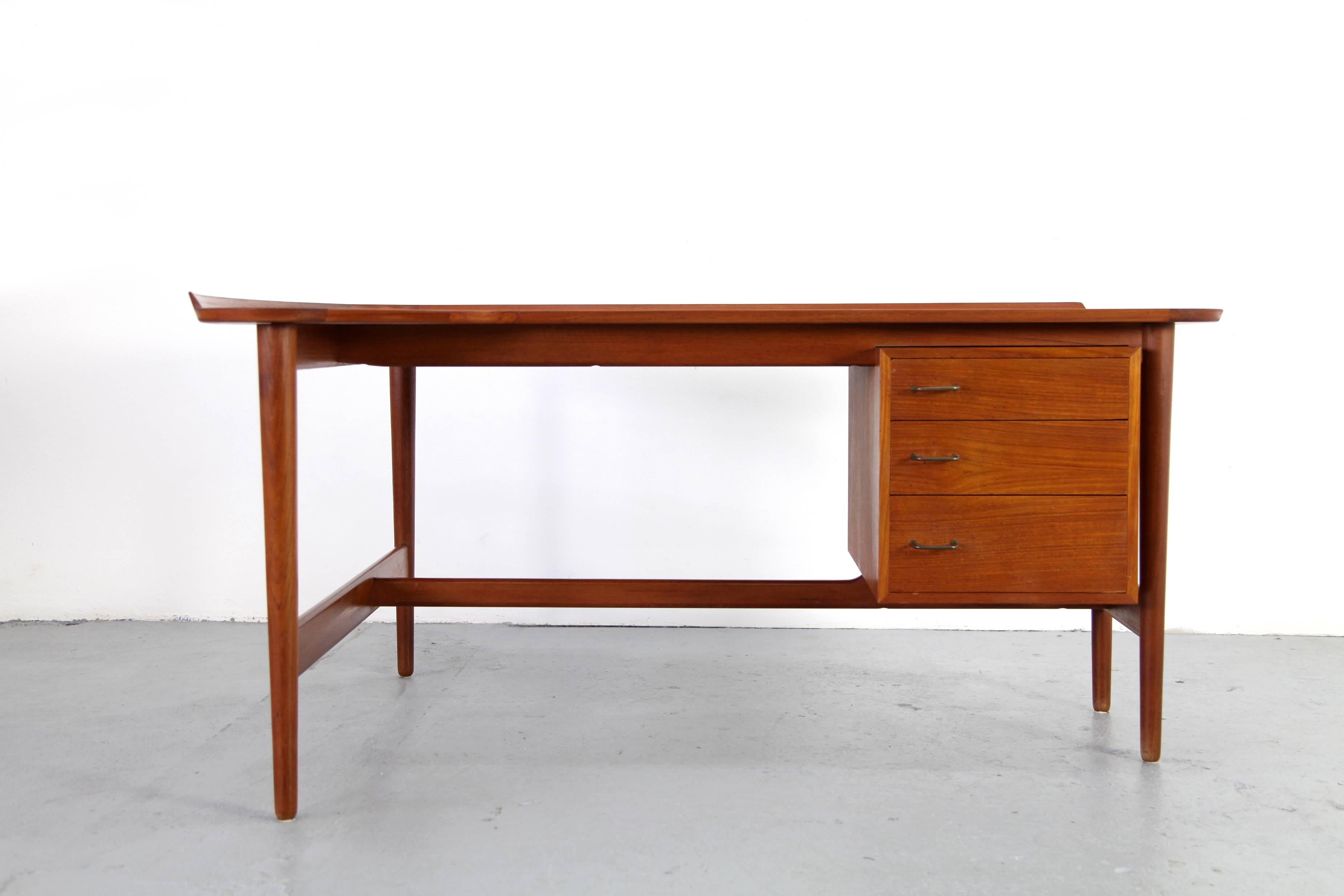 Exceptionally beautiful desk, designed by Arne Vodder, manufactured by Bovirke in Denmark. Beautiful L-shaped tabletop. Delicate wooden frame. Great condition of use.