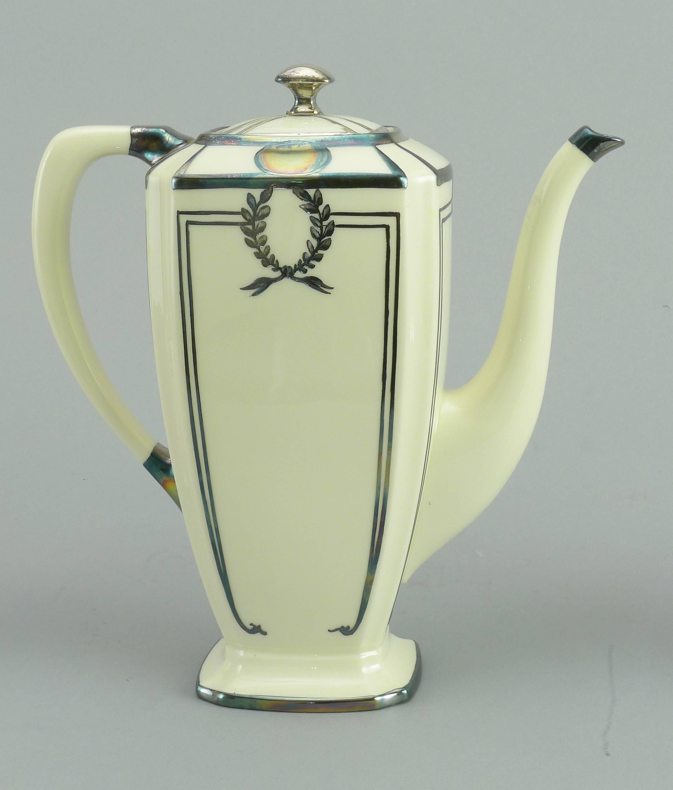 Three-piece Lenox, sterling overlay deco style tea set, in good condition, height teapot is 8 3/8 inches.