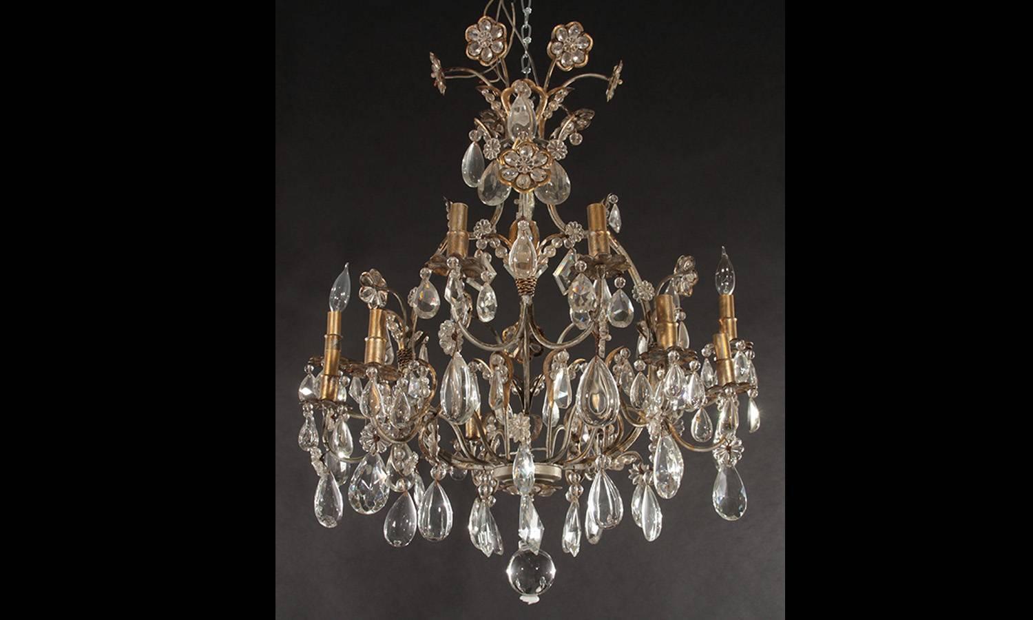 Hollywood Regency Gilt Decorated Wrought Iron and Crystal Eight-Arm Chandelier In Fair Condition For Sale In Newburgh, NY