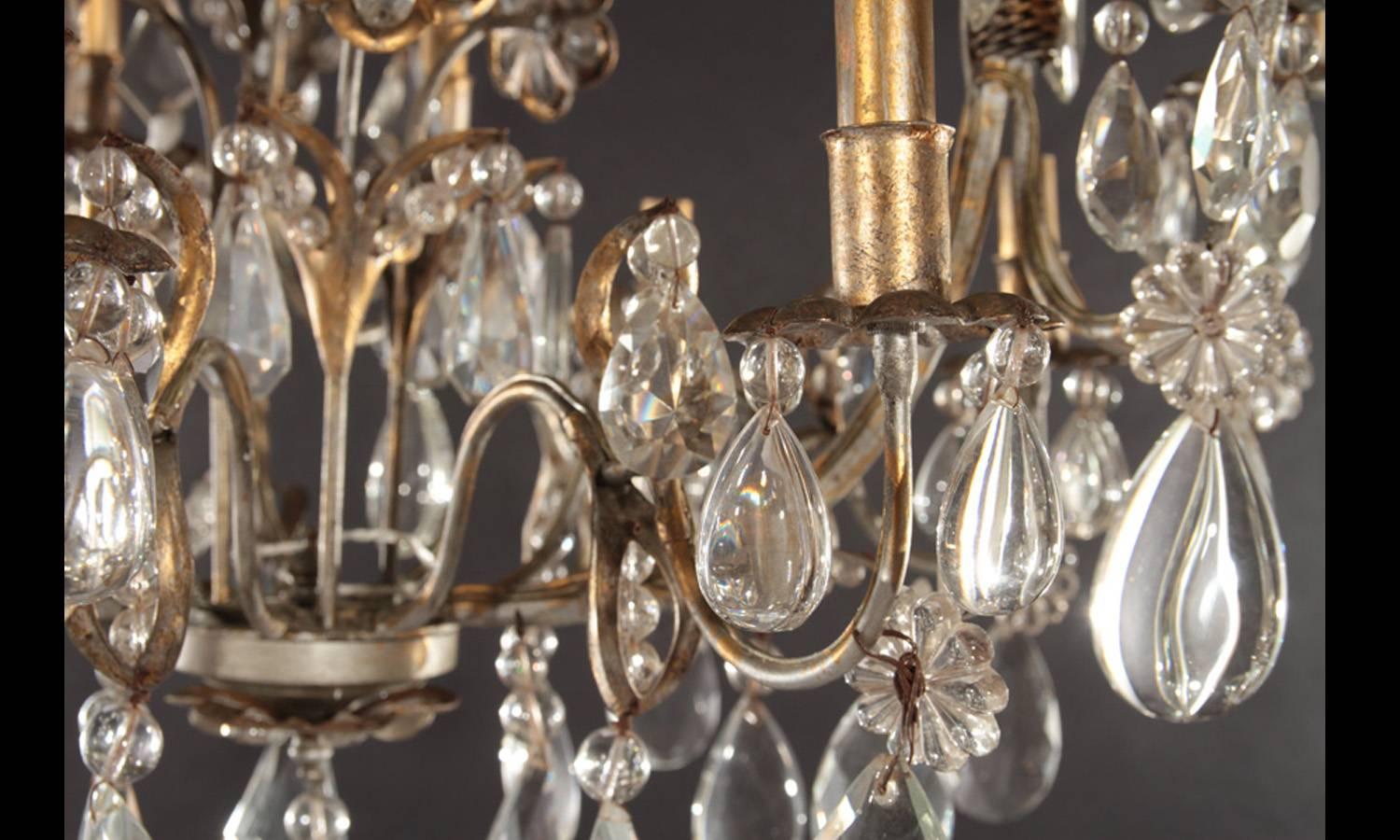 20th Century Hollywood Regency Gilt Decorated Wrought Iron and Crystal Eight-Arm Chandelier For Sale