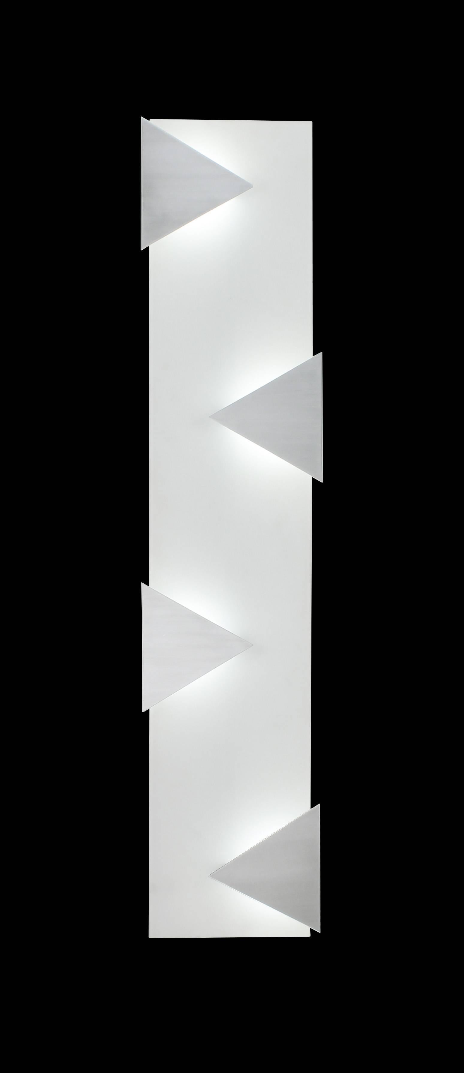 Triangular aluminium panels and white glass wall sculpture. Can be used in place of wall art as a decorative feature. In the manner of Mid-Century Modern design style with a Pop-Art feel. LED illuminated 3000K standard color temperature. Shown as a