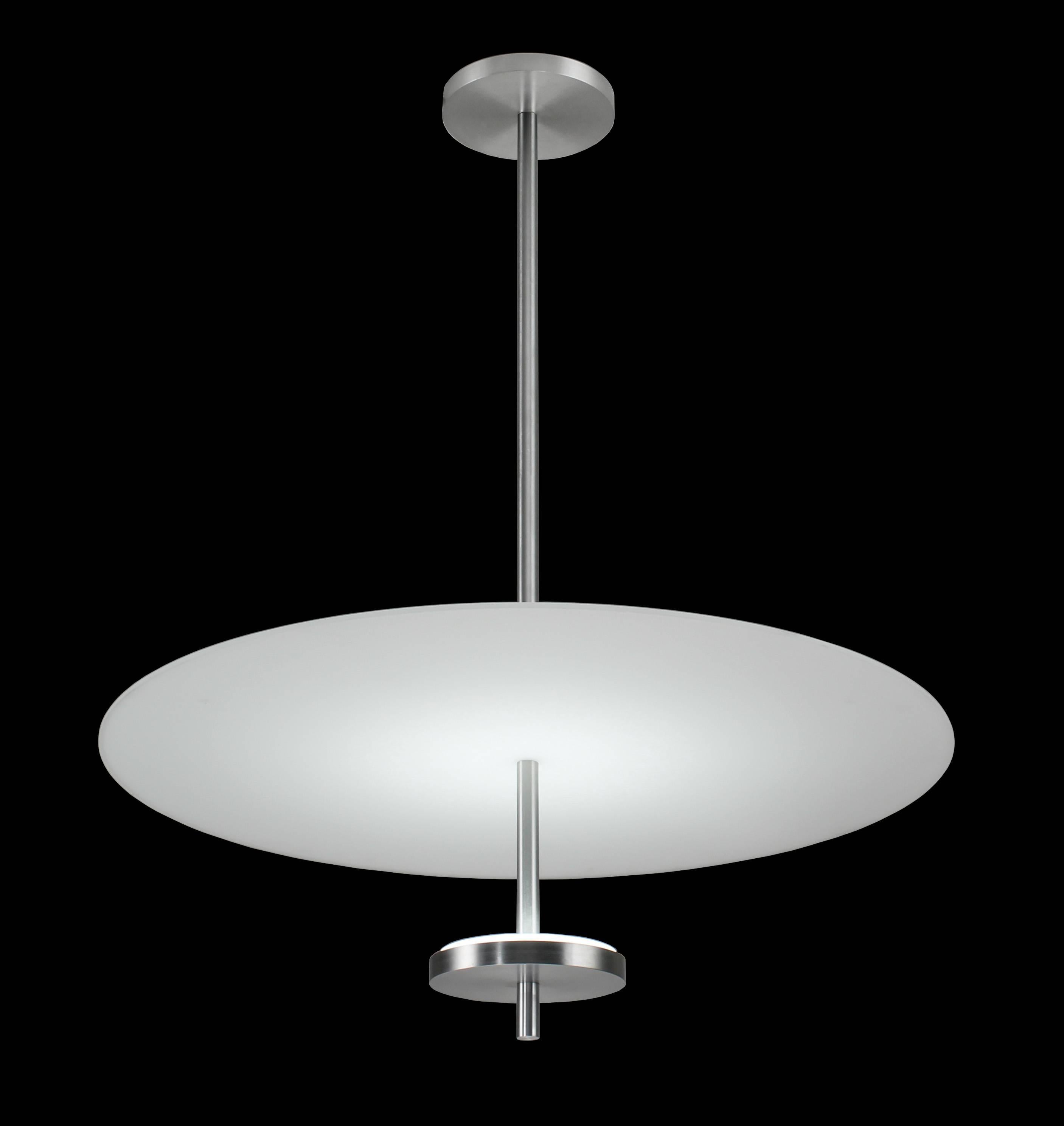 24 inch diameter flat glass pendant light. Mid-Century Modern style. Top glass acts as a reflector for the lower spread lens. Fixture provides reflected light downward and a soft light to the ceiling above through the top glass. LED illuminated,