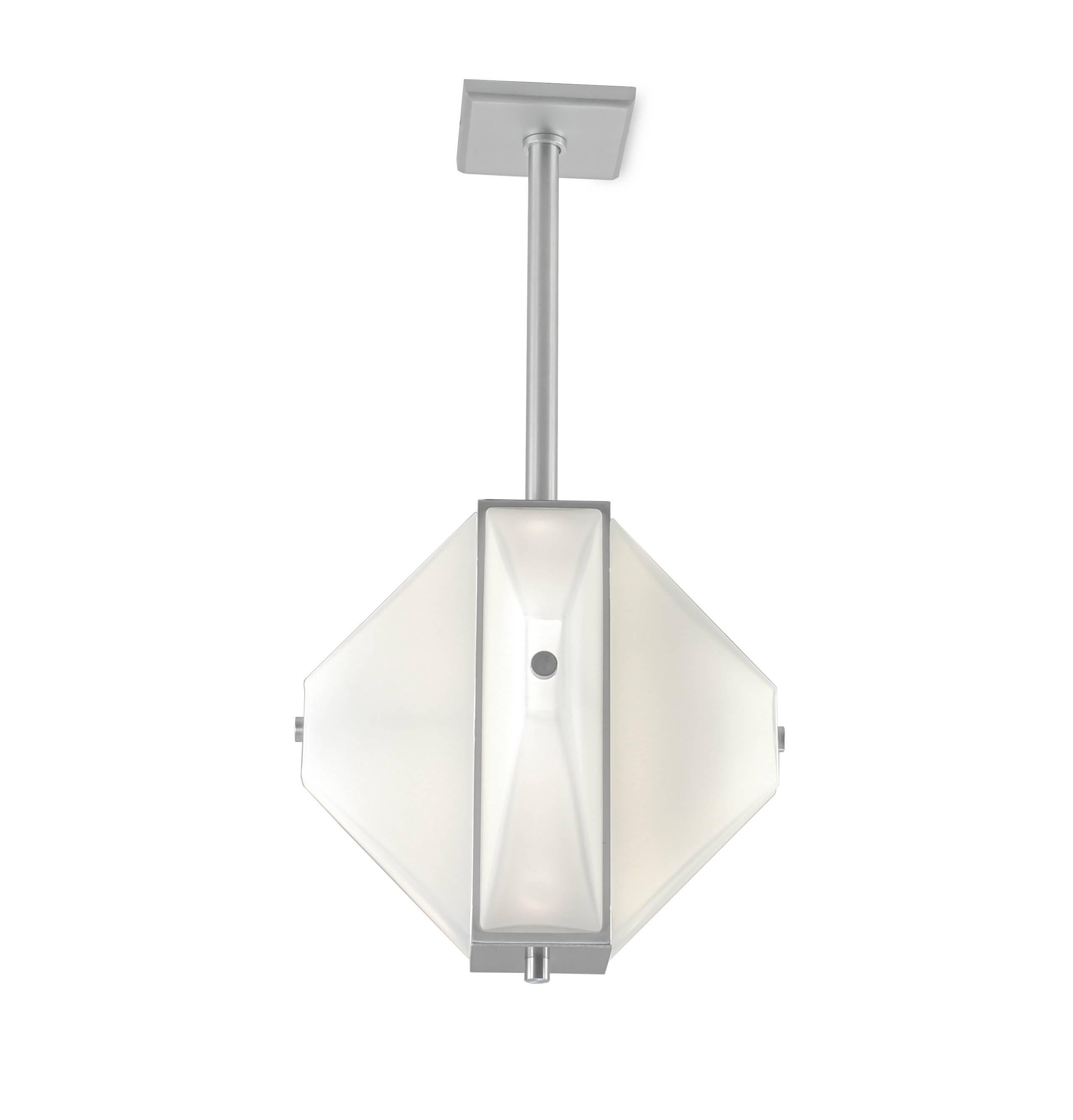 Pendant light in tapered white glass and satin aluminum. Mid-Century Modern inspired. Four tapered pyramid shaped glass diffusers suspended from a machined aluminum hub. Led lamping, standard color temperature 3000k.

Architect, Sandy Littman of