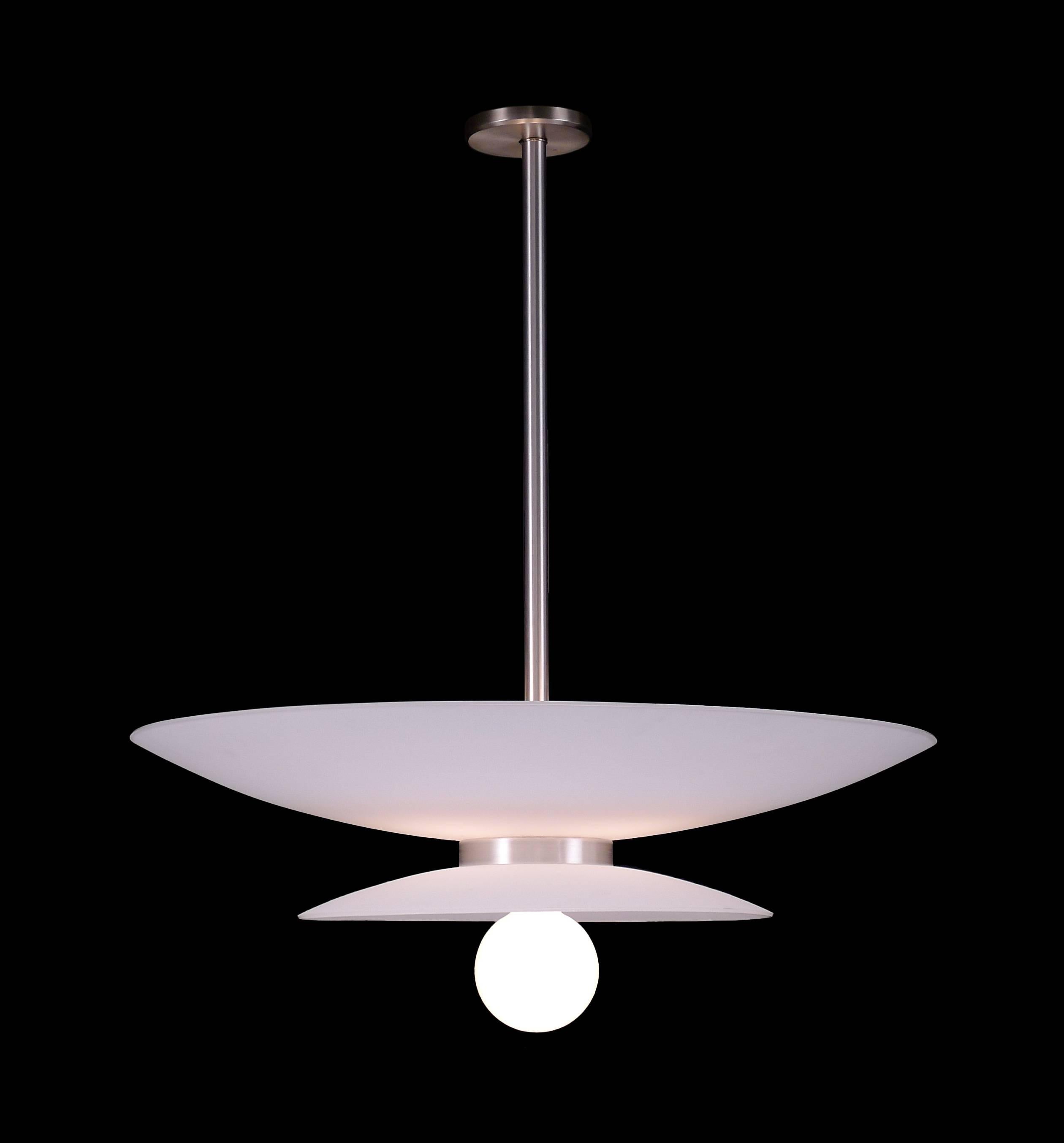 Large white glass pendant with up and down light. Bowl portion and lower lamp can be controlled separately.

Architect, Sandy Littman of Duesenberg LTD.  and The American Glass Light Company have been making beautiful objects and collecting gorgeous