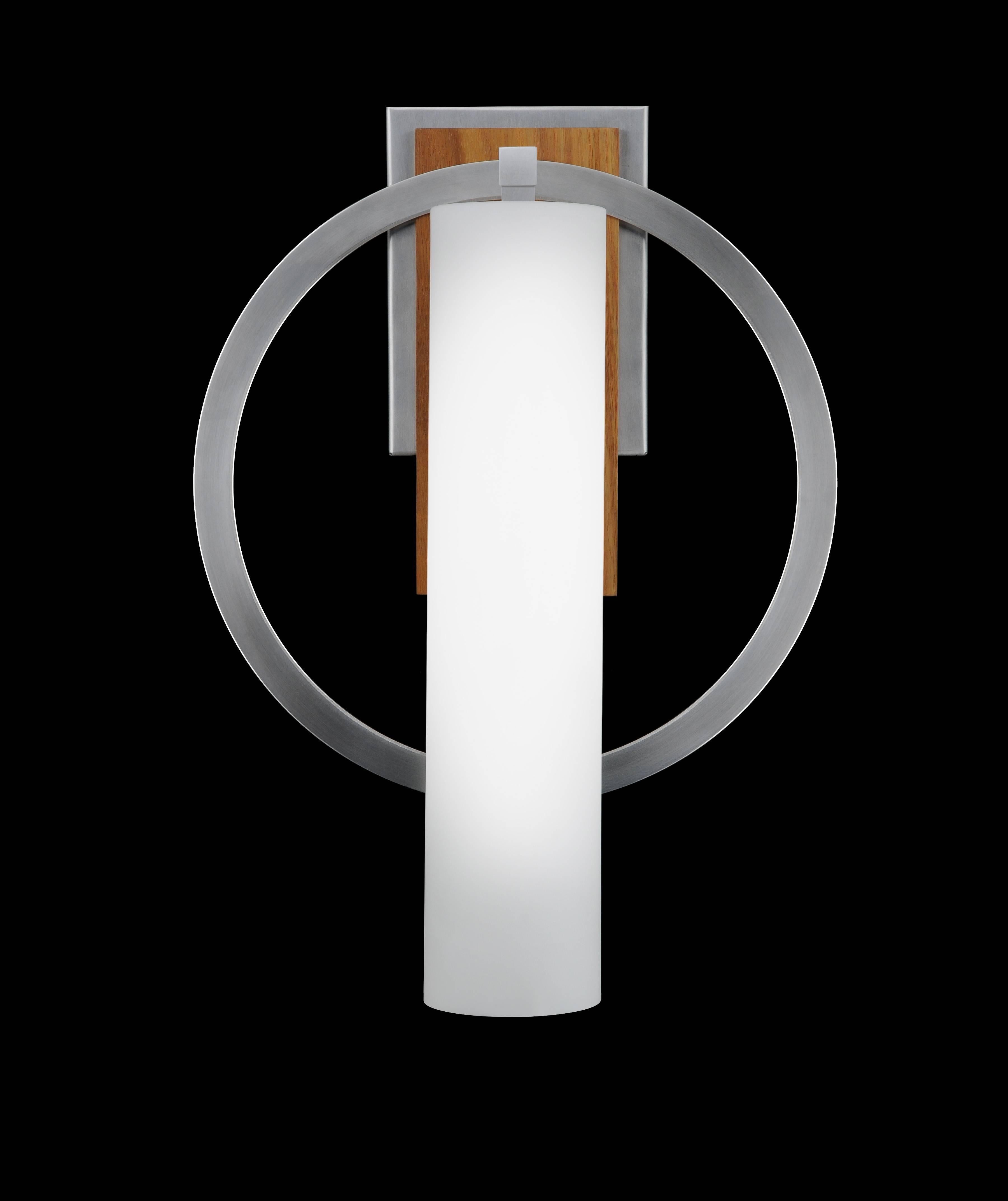 Cylinder shape sconce bisected with satin aluminum hoop with wood details.
Scandinavian Modern with a touch of arts and Crafts Design.

Architect, Sandy Littman of Duesenberg LTD.  and The American Glass Light Company have been making beautiful