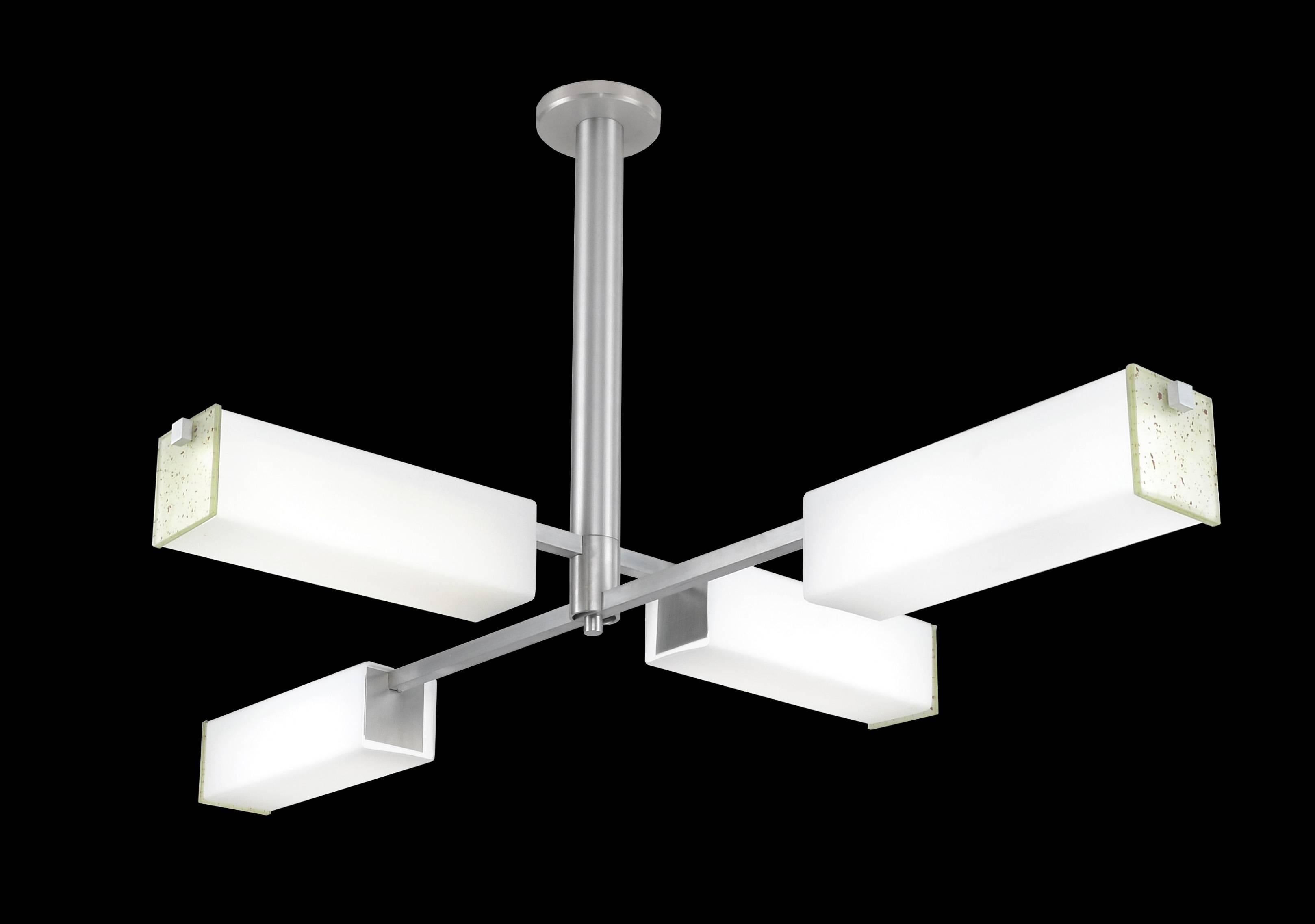 Four-arm LED chandelier in rectangular format. White square glass tubes give soft glow, clear frosted glass ends give sparkle. 3000K standard color temperature. Measures: 36 inches x 53 inches.

Architect, Sandy Littman of Duesenberg LTD.  and The