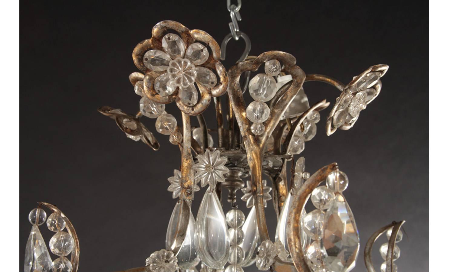 Hollywood Regency Gilt Decorated Wrought Iron and Crystal Twelve-Arm Chandelier For Sale 1