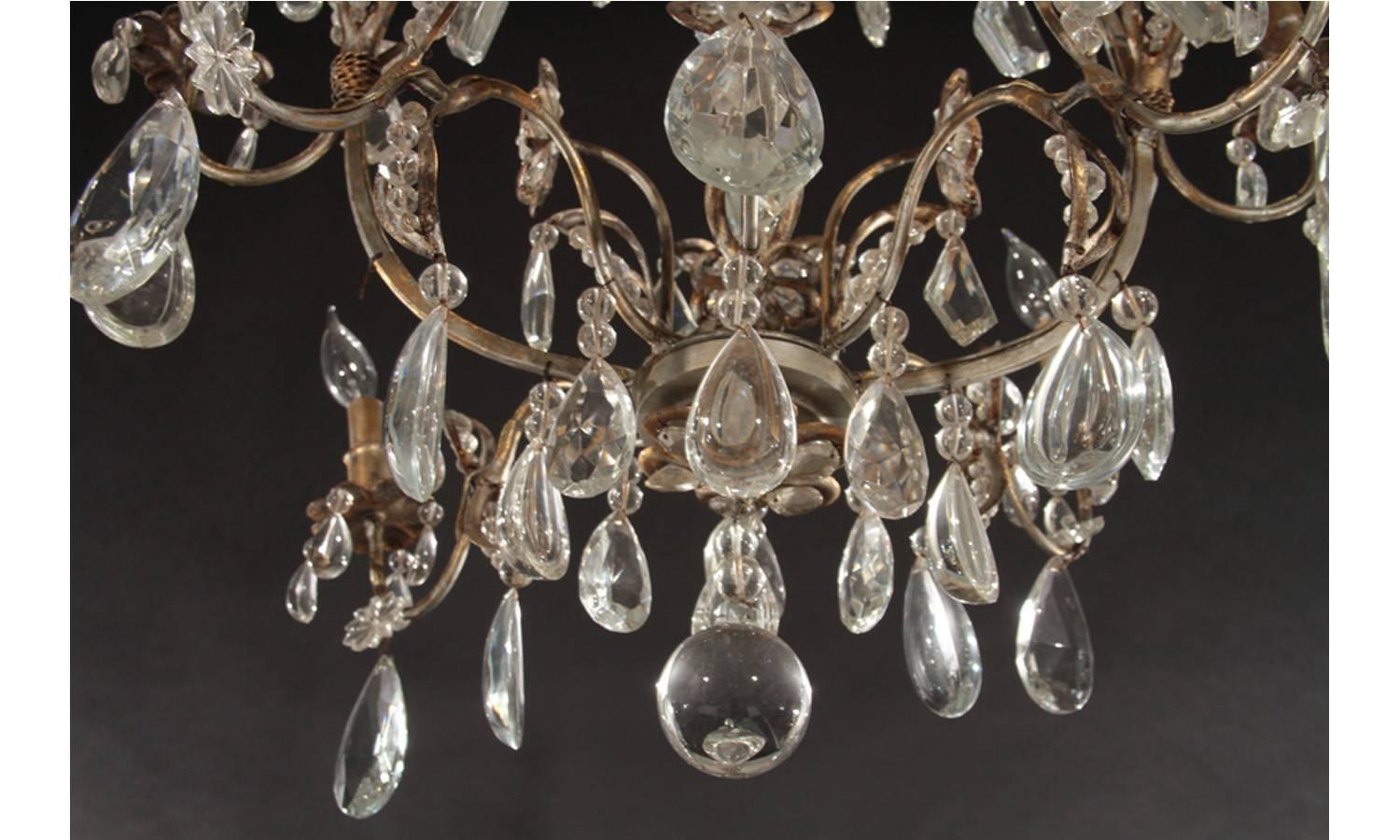 20th Century Hollywood Regency Gilt Decorated Wrought Iron and Crystal Twelve-Arm Chandelier For Sale
