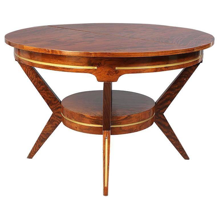 Walnut Mid-Century Modern dining table. Made of highly figured walnut. With painted gold details. Circular lower base shelf, four tapered legs. Purchase includes French Art Deco Lantern. 1930s-1940s, French. Purchased in Paris. Made of burled wood