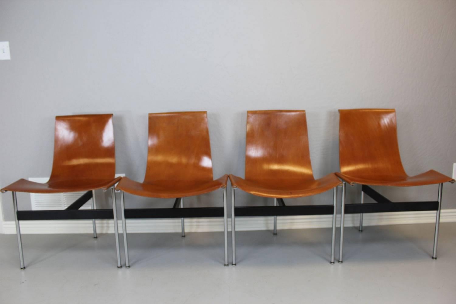 Set of four original William Katavolos leather sling T-Chairs manufactured by Laverne International. Spectacular vintage patina each chair.