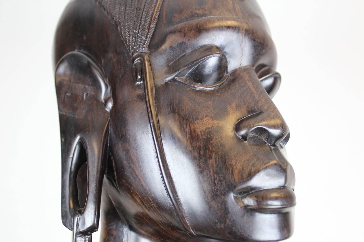This piece was acquired from a collector who is downsizing her amazing collection.  This piece was hand carved by an artisan in Africa from one piece of heavy ironwood.  Note the equisite detail in the images.  The African sculptor utilized the