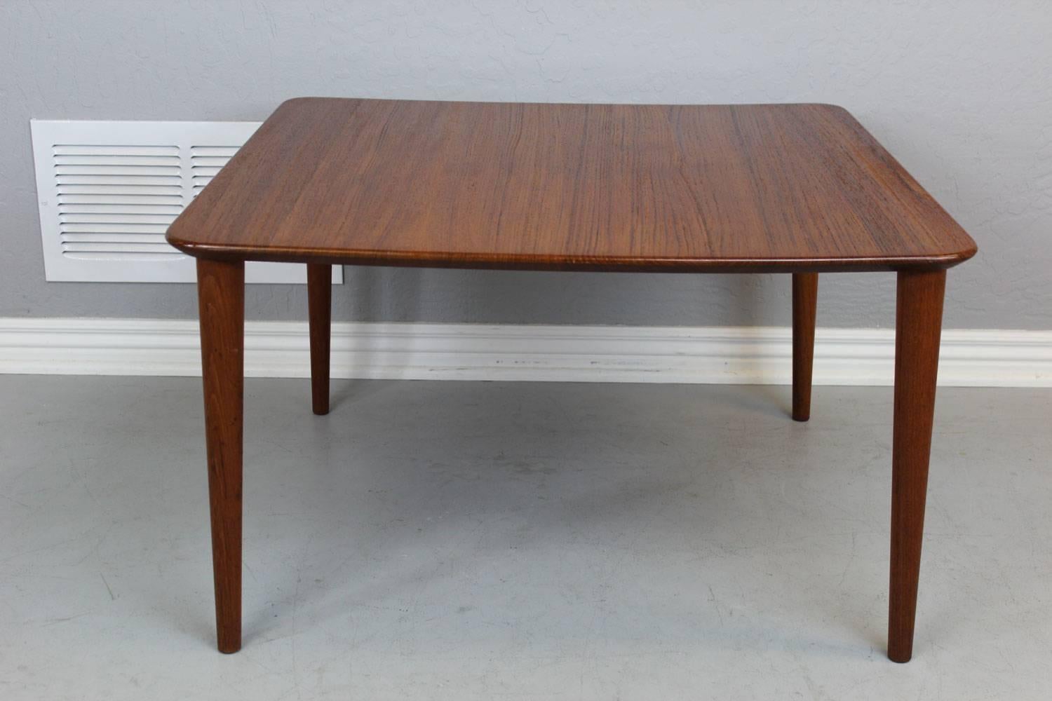 Solid teak end table manufactured by France & Daverkosen in 1959.