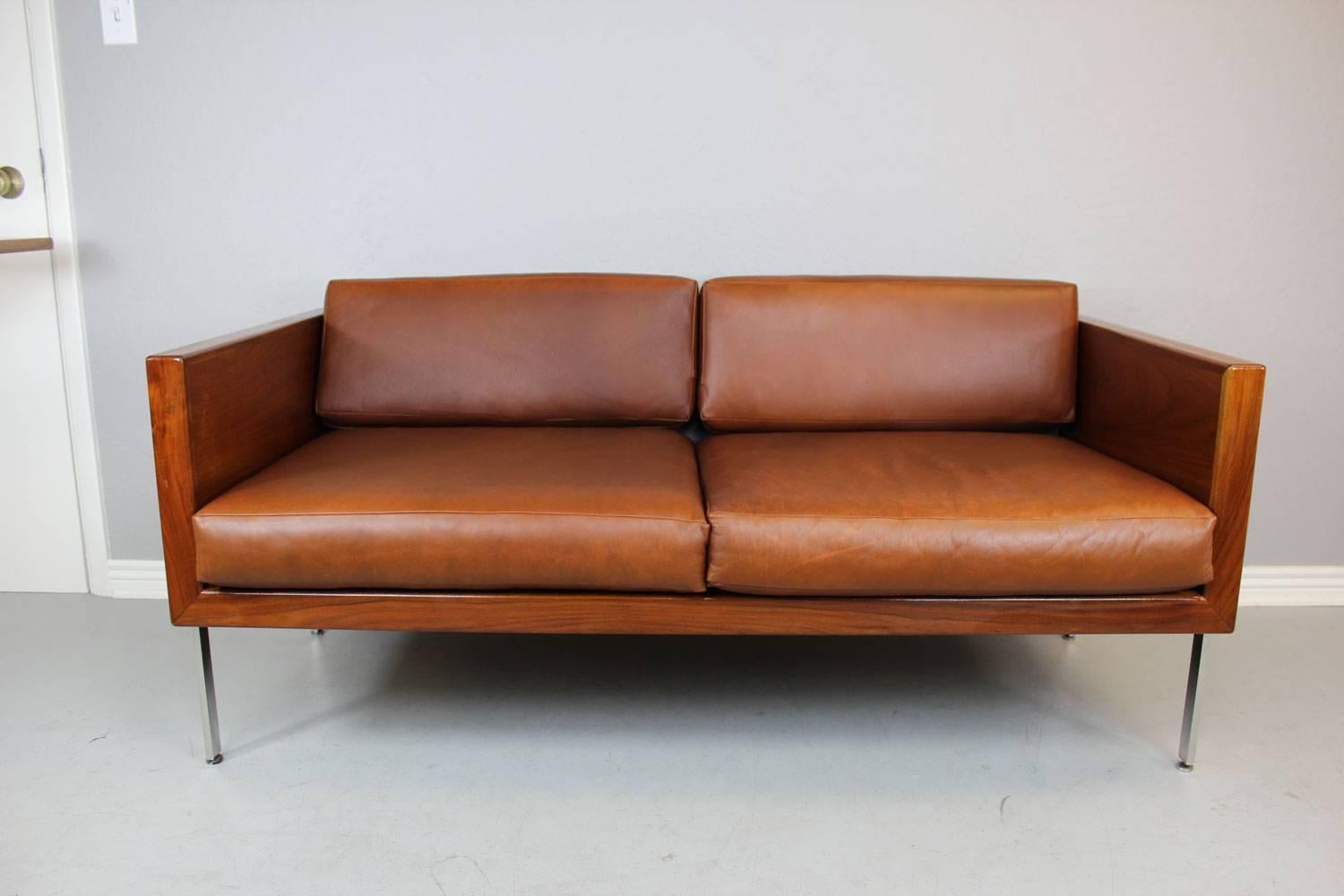 Architectural series sofa in walnut, stainless steel and leather by Harvey Probber. Professionally restored, however, the original leather remains as it is in very good condition with a nice overall patina. This unit has new bottom webbing. See