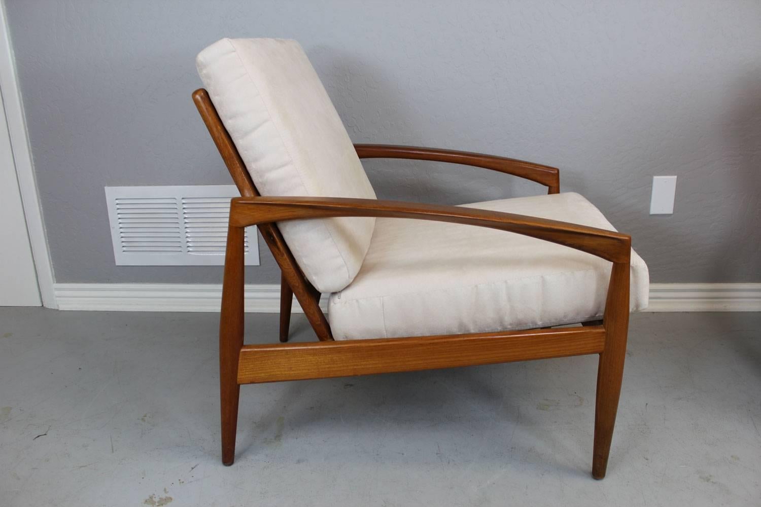 Pair of Kai Kristiansen lounge chairs.  Reupholstered in a brushed cotton/poly velvet fabric.  Very nice. 