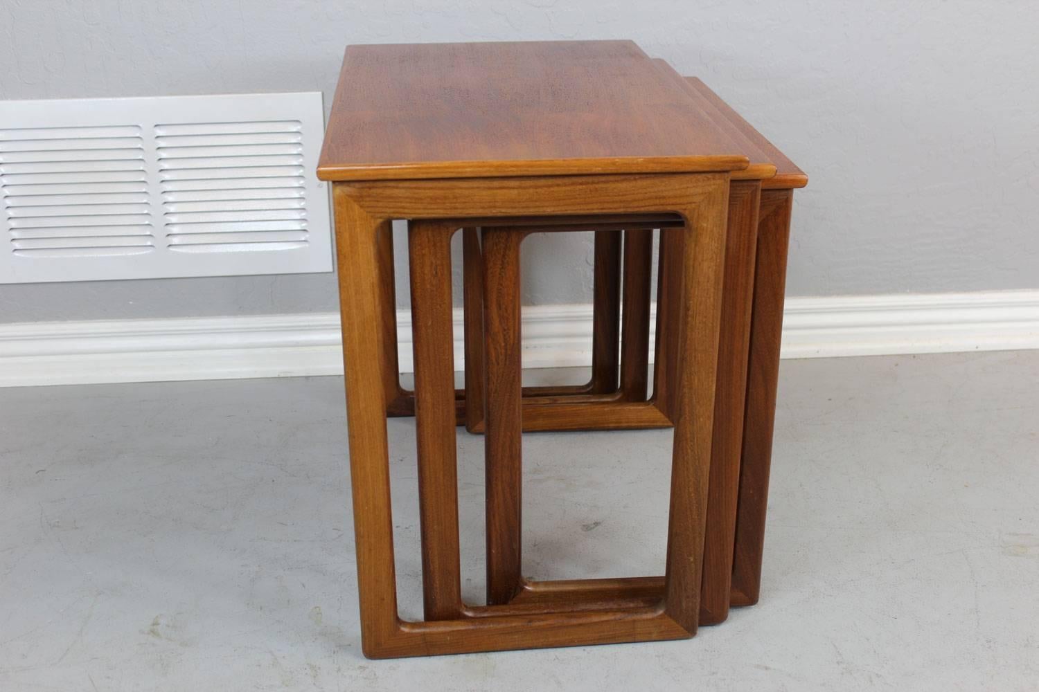 Teak nesting tables designed by A. Kildeberg, circa 1960. 

Dimensions of biggest table are outlined below.